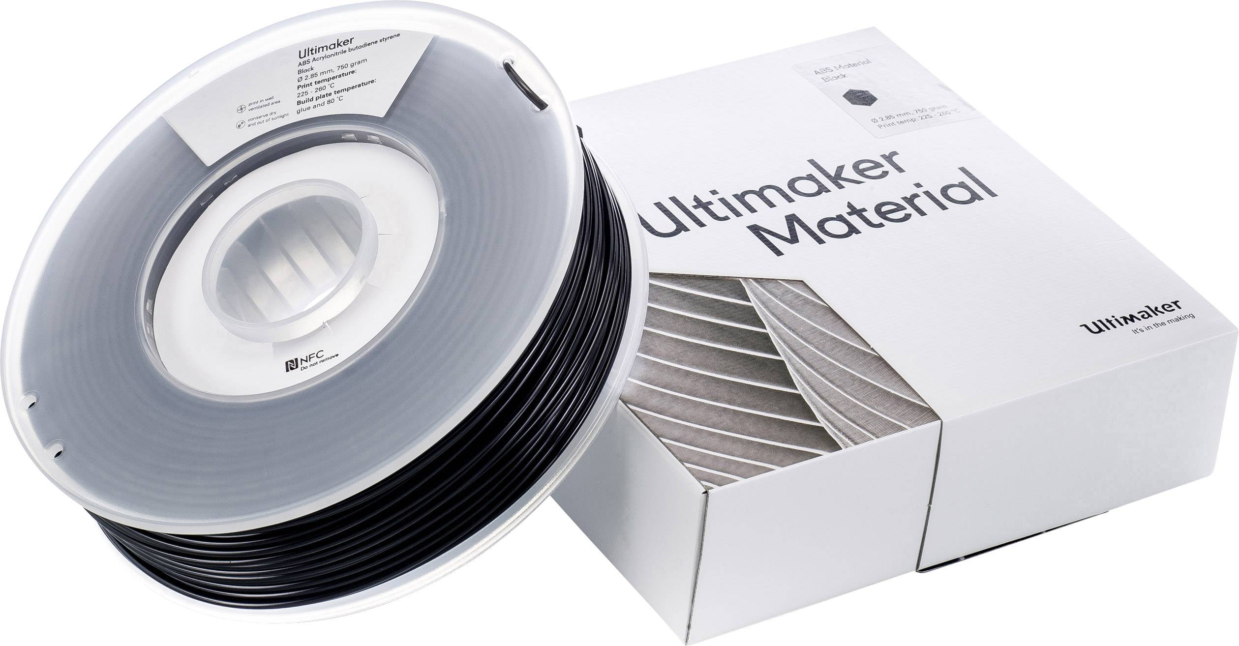 3D-printfilament van Ultimaker, zwarte PLA-spoel naast een verpakking met de tekst 'Ultimaker Material'.