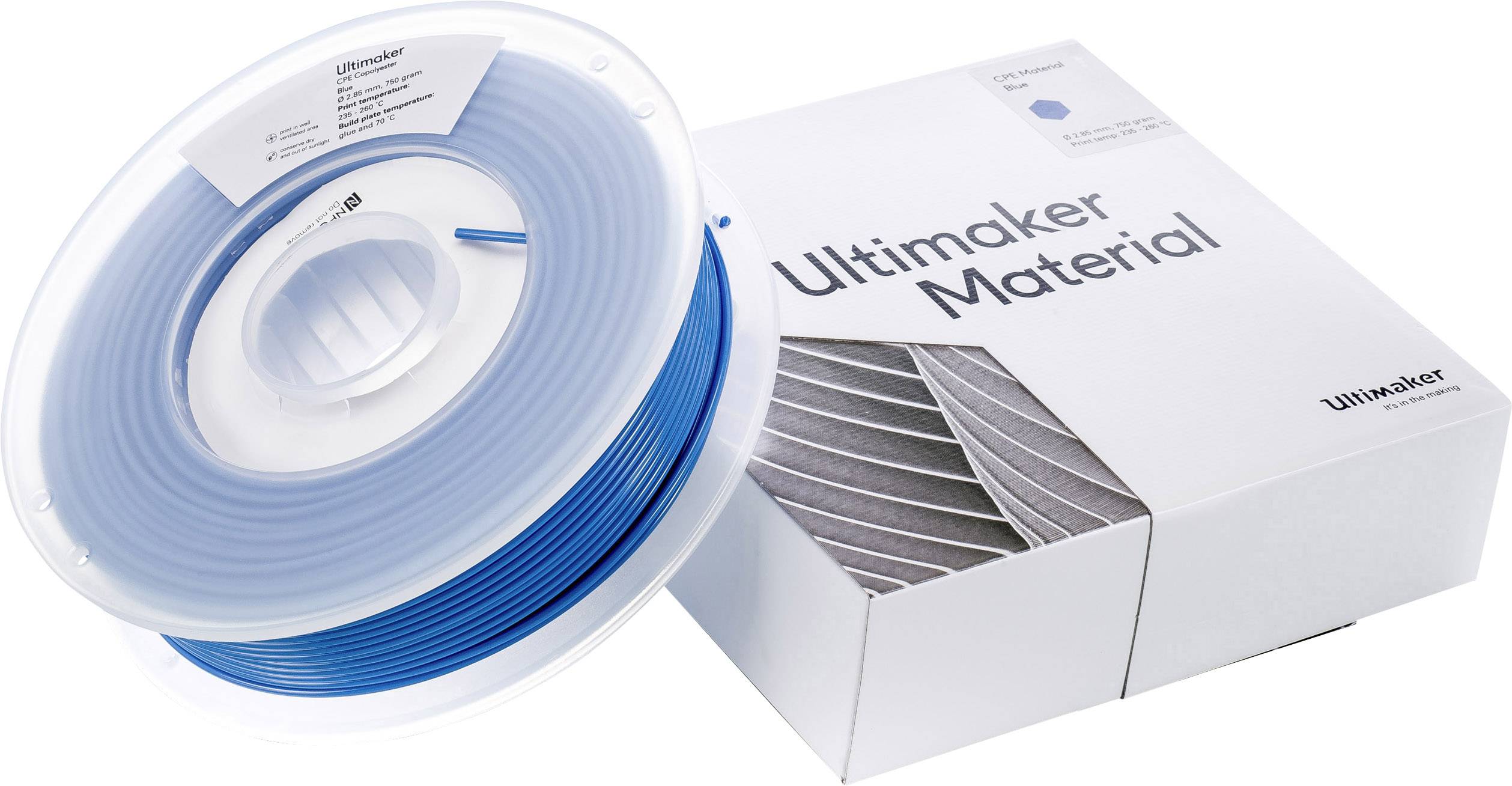 Een blauwe 3D-printfilamentspoel naast een witte verpakking met de tekst 'Ultimaker Material'.
