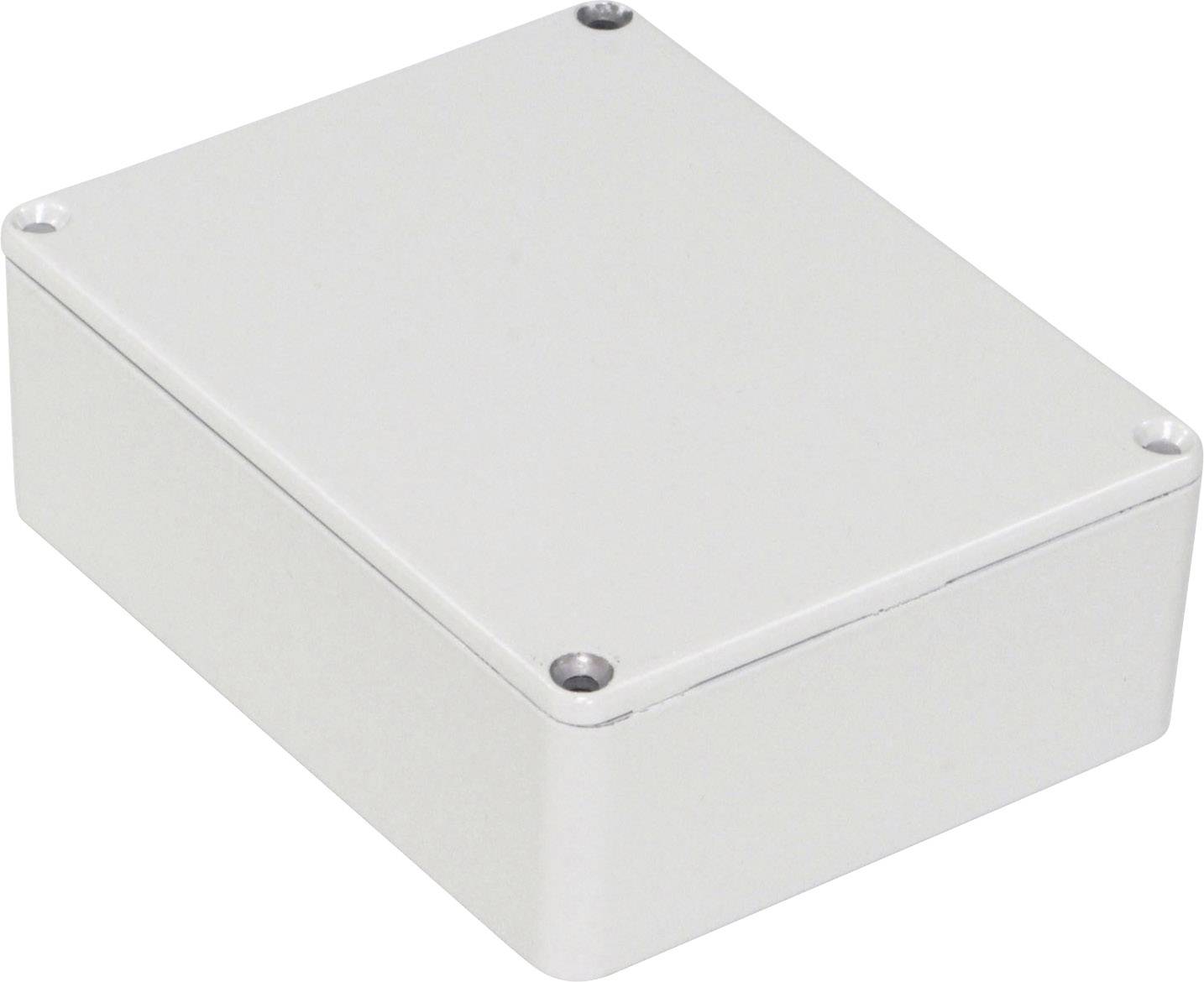Witte, rechthoekige metalen doos met afgeronde hoeken. Hij heeft vier schroeven op elke hoek van het deksel.