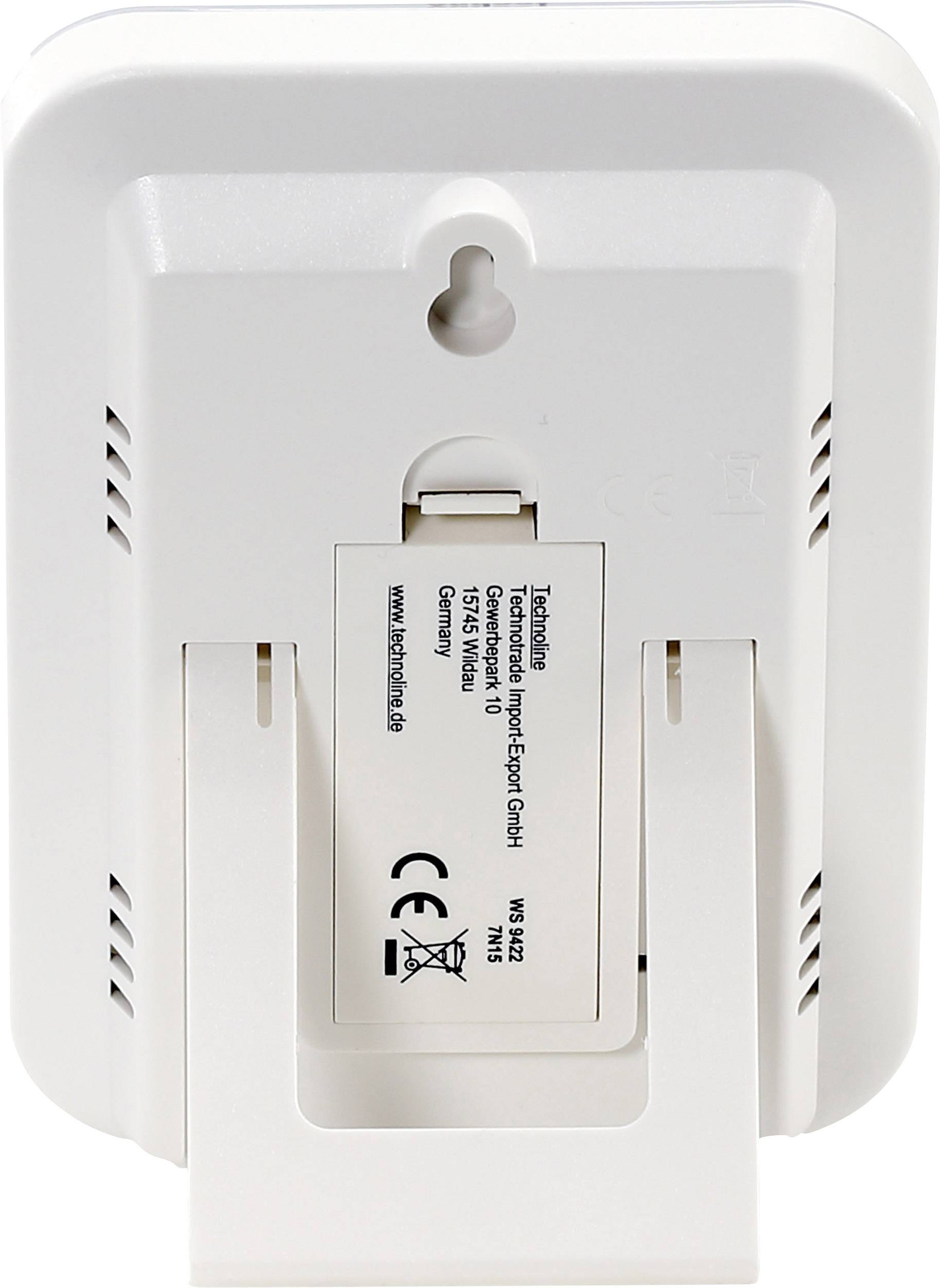 Achterkant van een digitale thermometer met standaard en wandbevestiging, toont batterijvak en fabrikantgegevens.