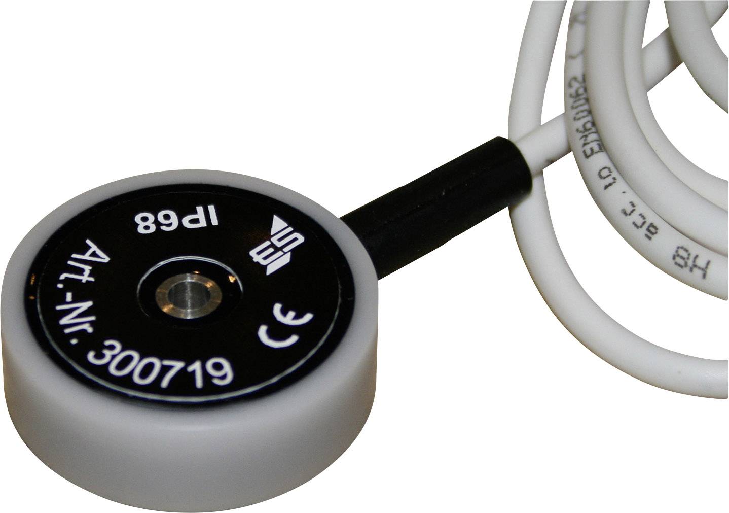 Kleinere, ronde sensor met kabel, opschrift: 'Art.-nr. 300719', symbolen voor CE en andere certificeringen, vermoedelijk technisch apparaat.