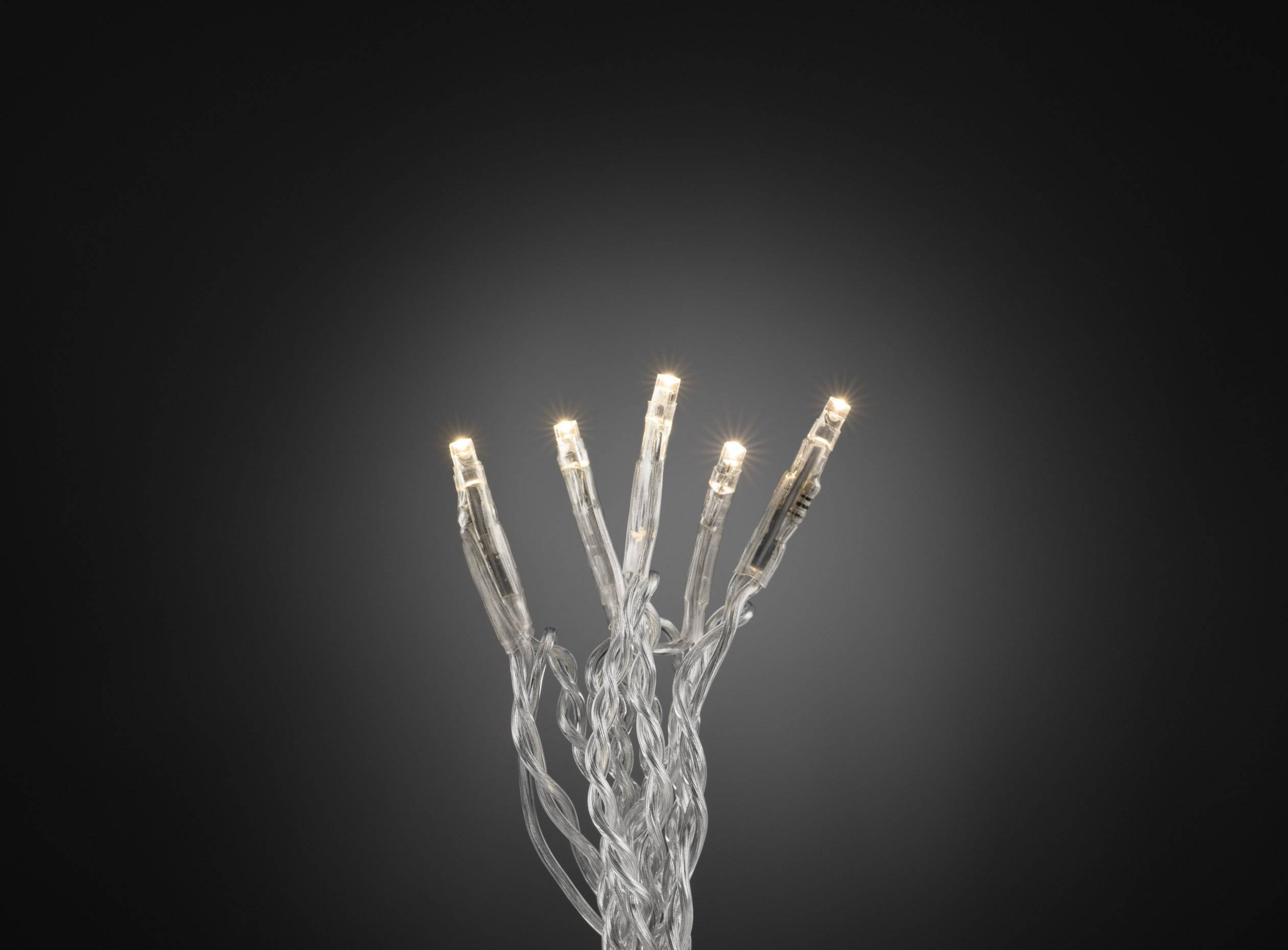 Lichtgevende LED-lampjes in transparante kabels tegen een zwarte achtergrond, abstract gerangschikt als een hand met uitgespreide vingers.