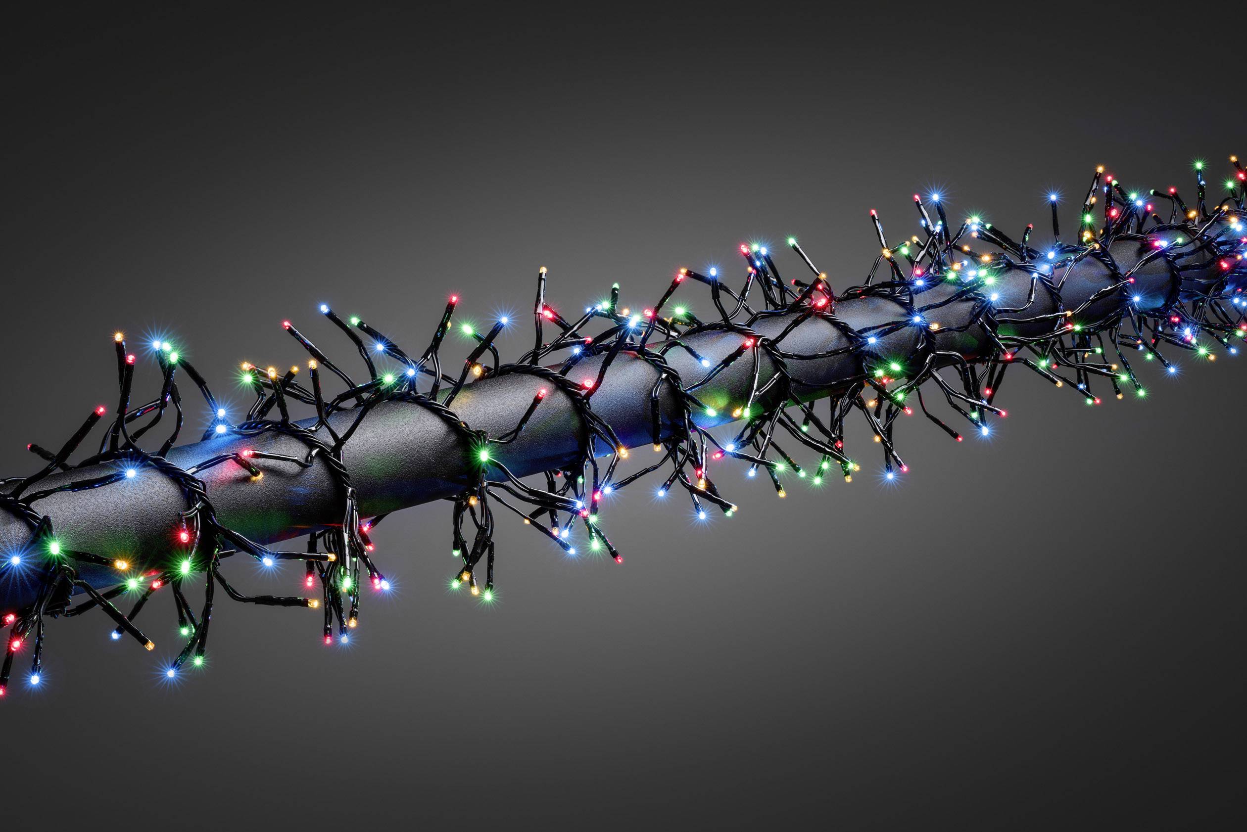 Een zwarte staaf, omwikkeld met een LED-lichtsnoer in verschillende kleuren, licht op tegen een grijze achtergrond.