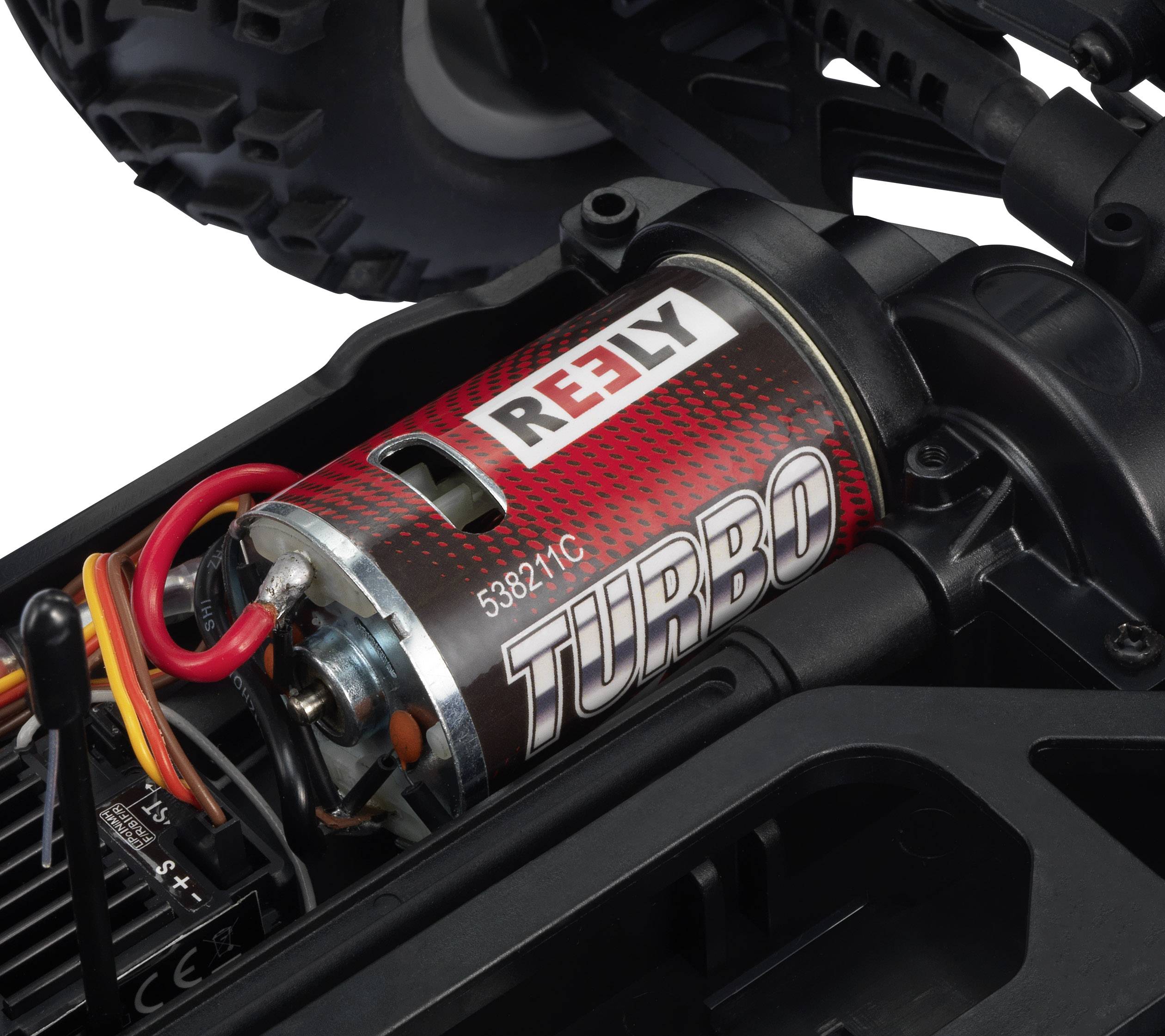 Close-up van een modelbouw-automotor met het opschrift 'REELY TURBO'. De motor heeft rode details, kabels en is gemonteerd in een voertuig.