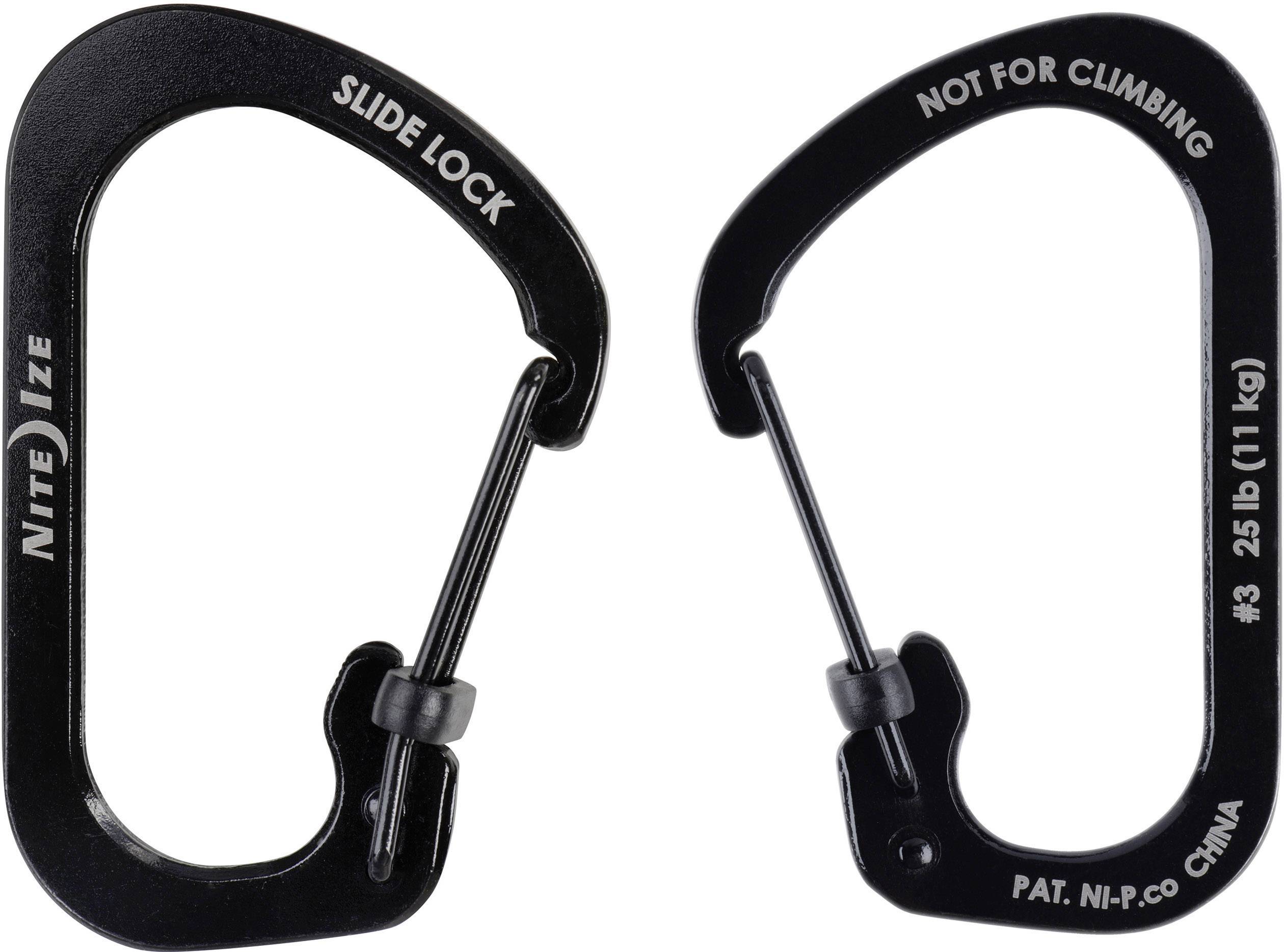Twee zwarte karabiners met de opschriften 'Not for climbing' en 'Slide lock'. Ze zijn gemaakt van metaal en hebben een vergrendelingsmechanisme.