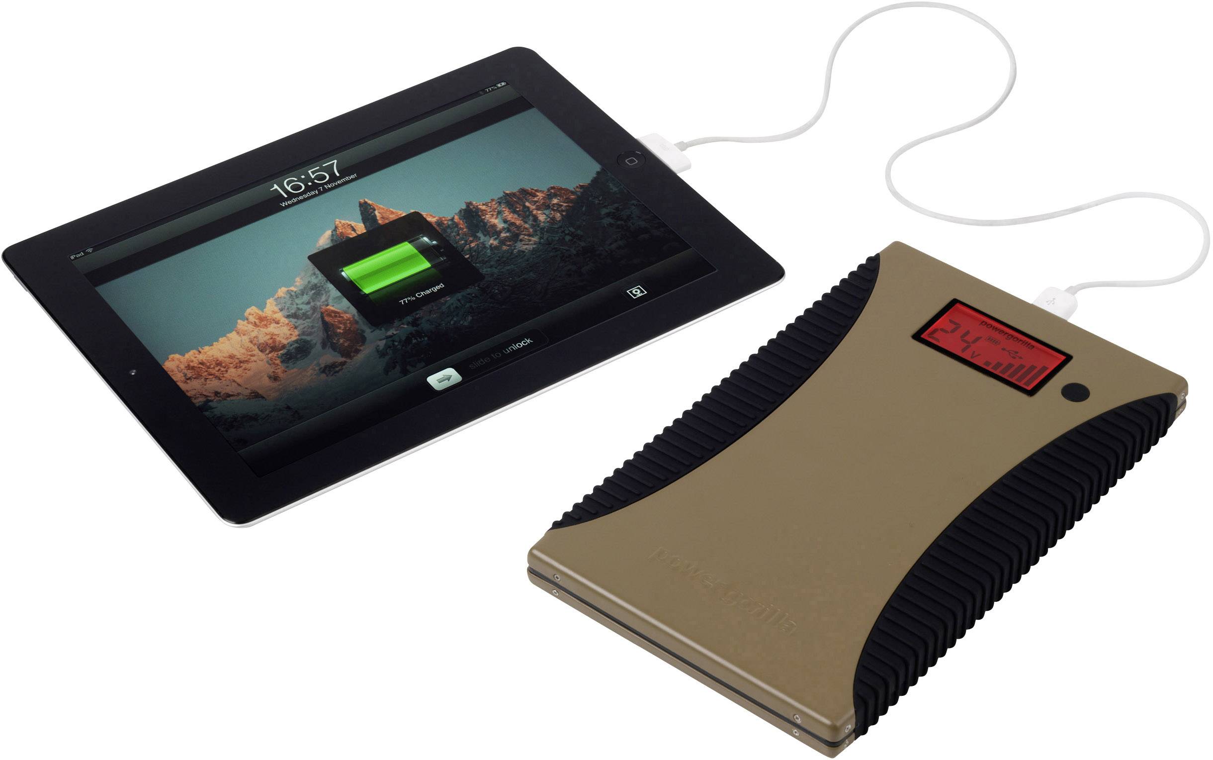 Tablet en externe accu verbonden, tablet toont 74% batterijniveau, berglandschap op het tabletscherm als achtergrond.