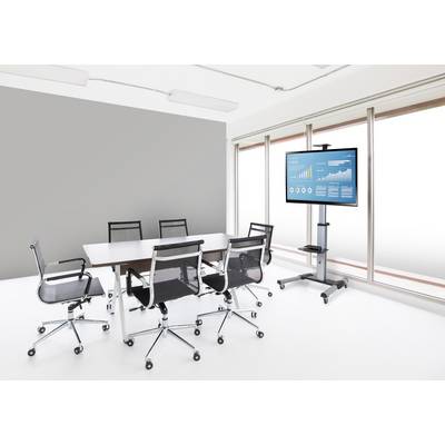Vergaderzaal met een tafel, zes stoelen en een scherm dat een diagram met bedrijfsgegevens toont. Lichte, moderne inrichting.