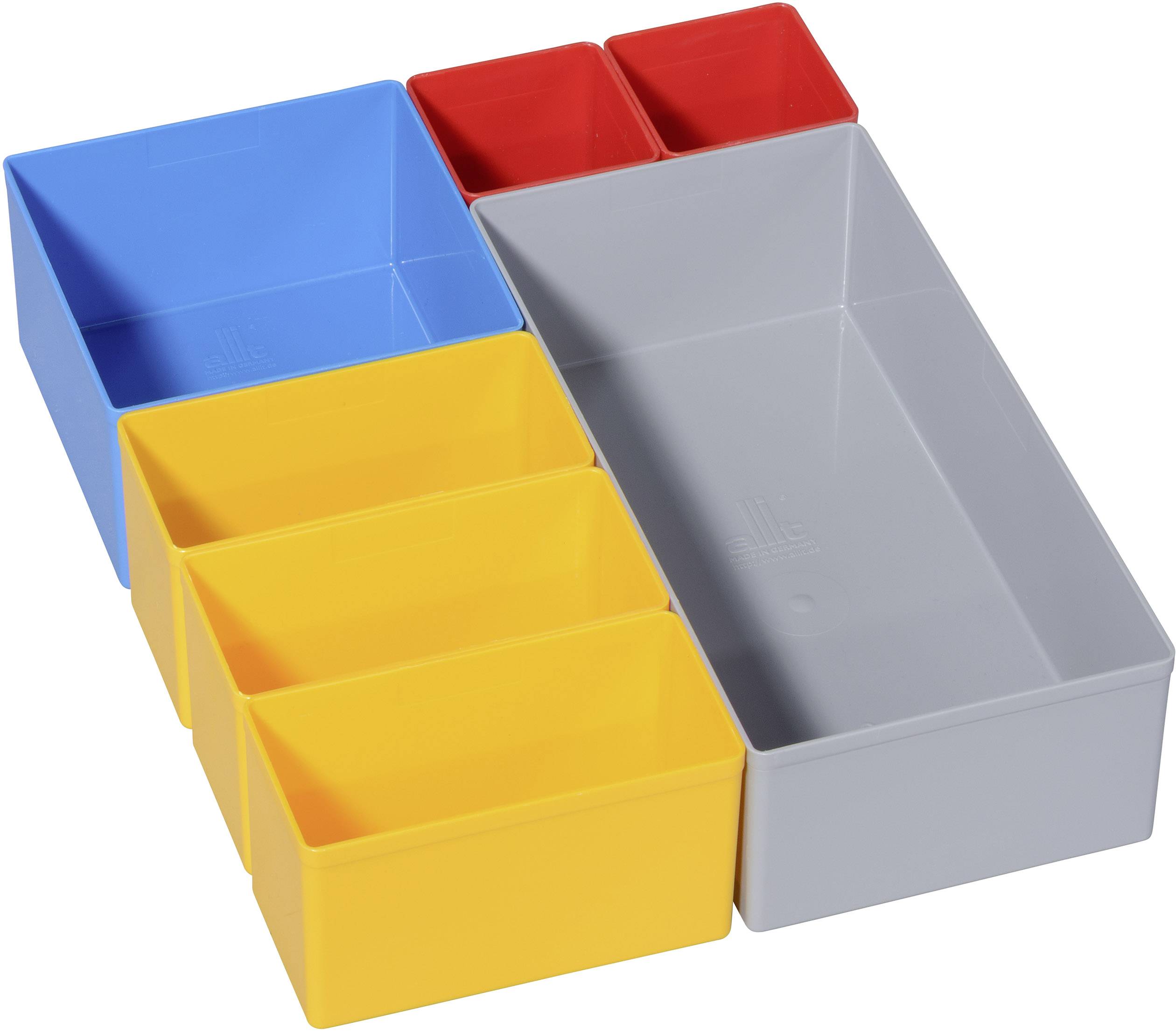 Kleurrijke, in elkaar passende opbergdozen in verschillende formaten en kleuren: Blauw, Geel, Grijs en Rood, gerangschikt op een tafel.