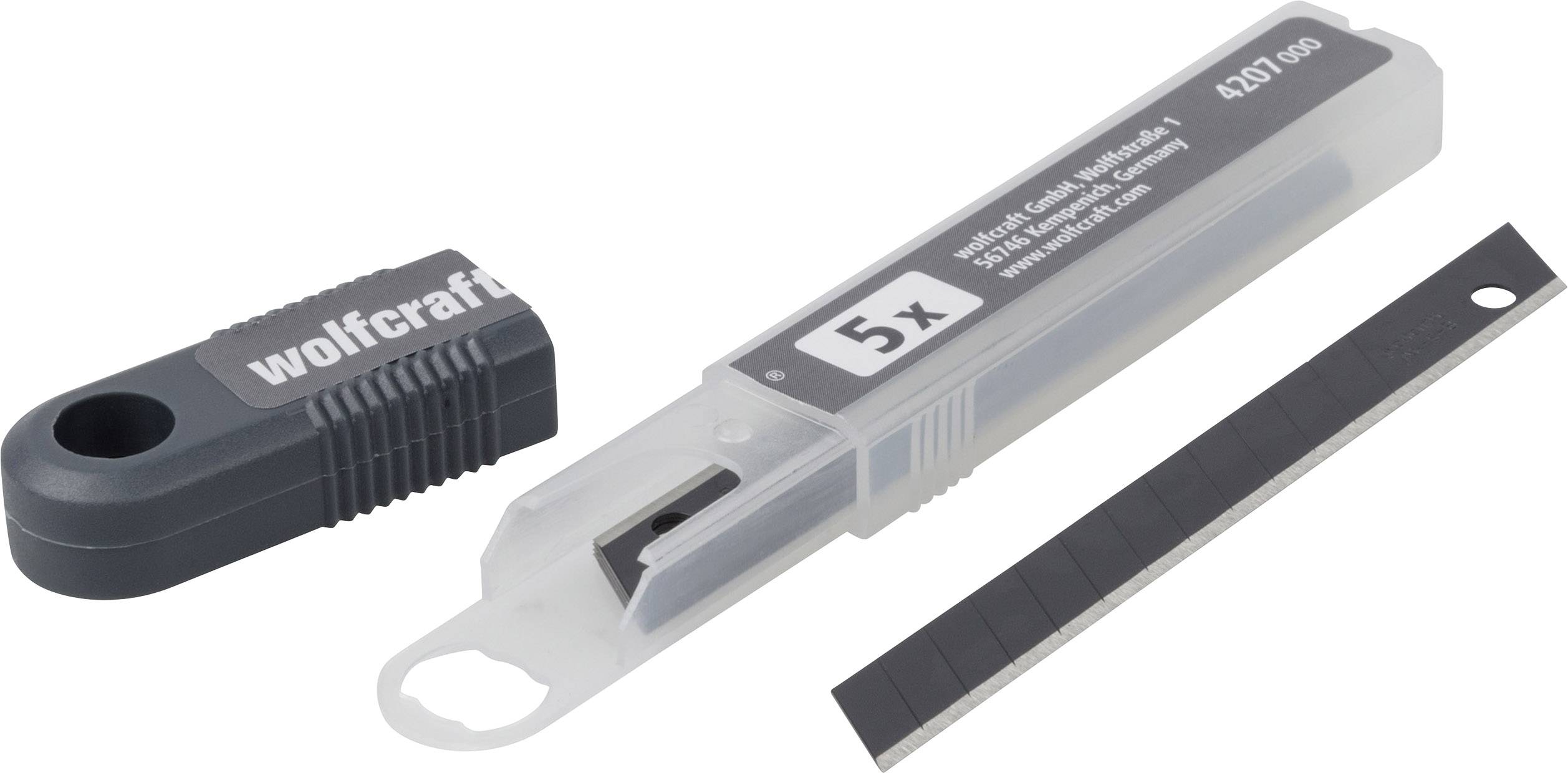 Vijf reservemessen in een transparante plastic verpakking met een afneembaar handvat, gemerkt met 'wolfcraft'.