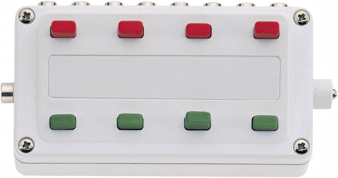 Een elektronisch apparaat met zes knoppen, waarvan drie rood aan de bovenkant en drie groen aan de onderkant, op een rechthokkast van wit.