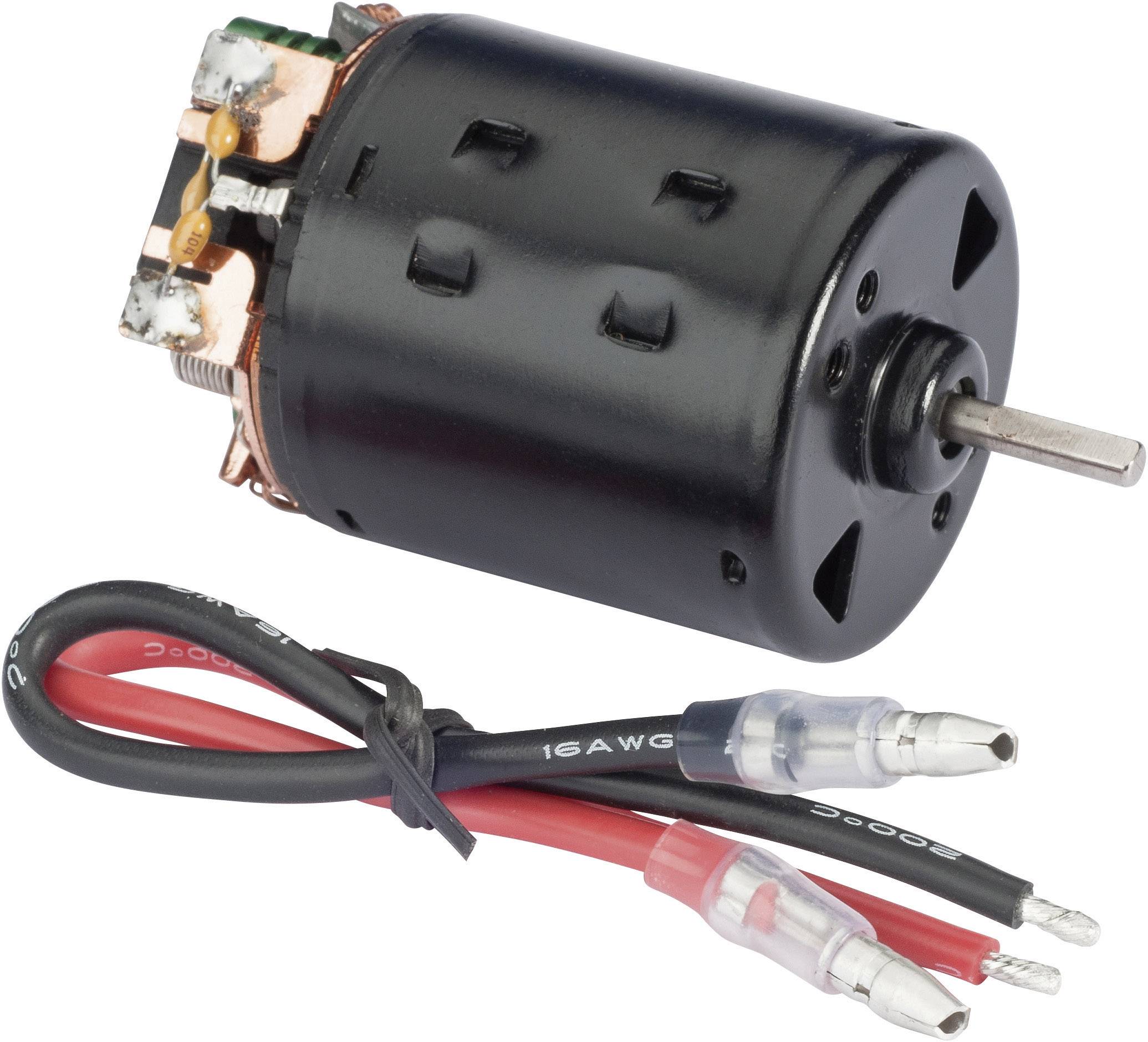 Een kleine elektromotor met roterende as, naast twee kabels met stekkeraansluitingen, gemerkt in rood en zwart.