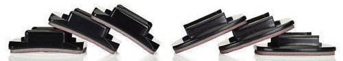 Vier zwarte kunststof onderdelen met schuine vlakken, symmetrisch gerangschikt in twee groepen.