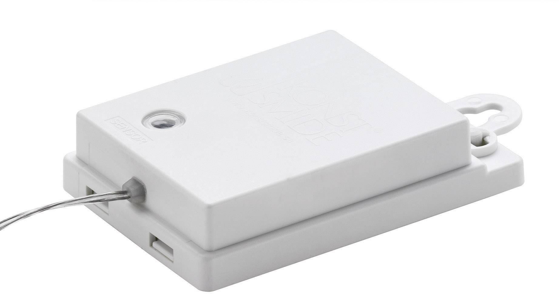 Wit rechthoekig elektronisch apparaat met kabel, mogelijk een sensor of schakelaar, op witte achtergrond.