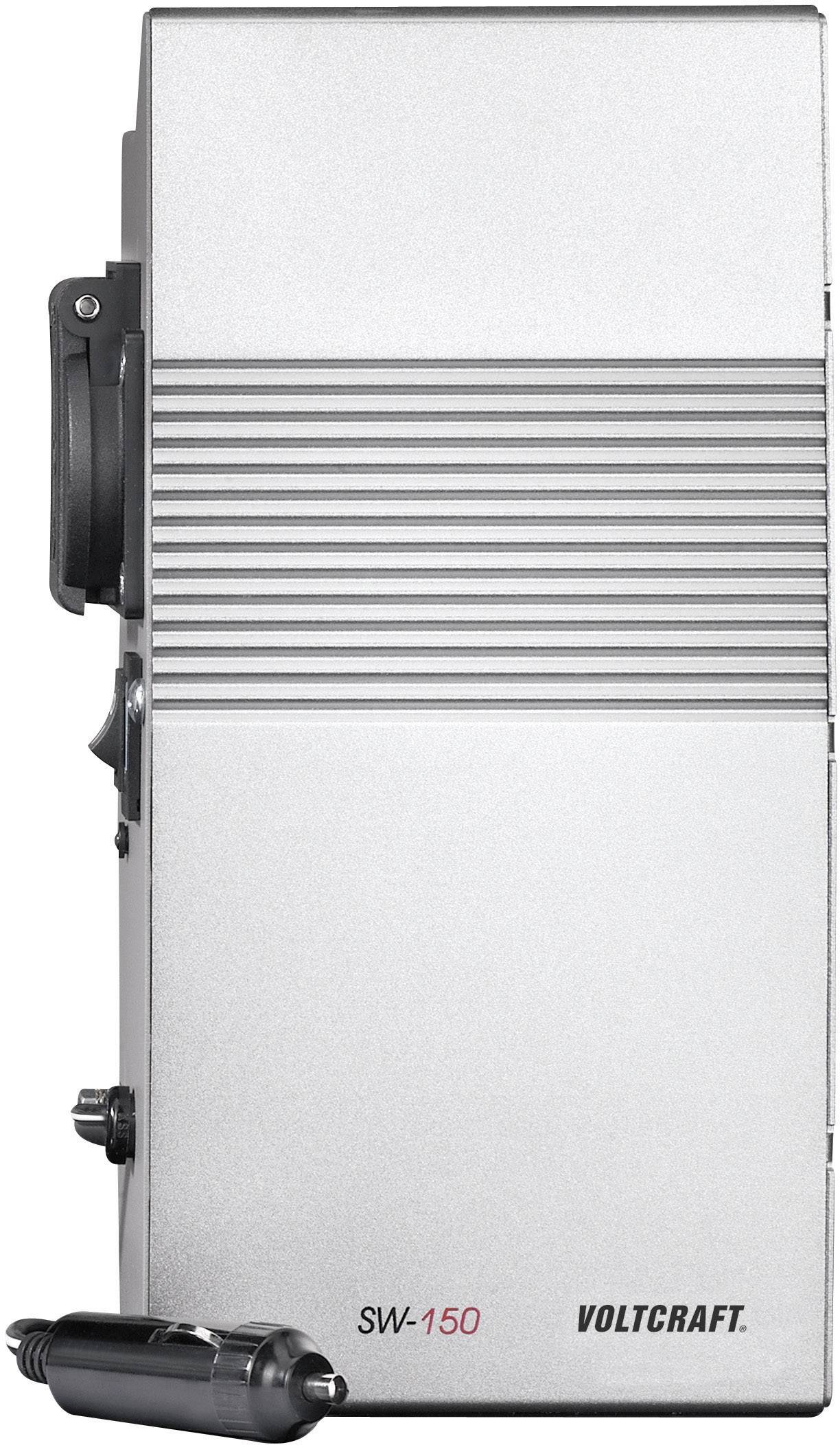 Zilveren apparaat met het opschrift 'VOLTCRAFT' en modelnummer 'SW-150'; aan de zijkant is een zwarte autoadapter bevestigd.