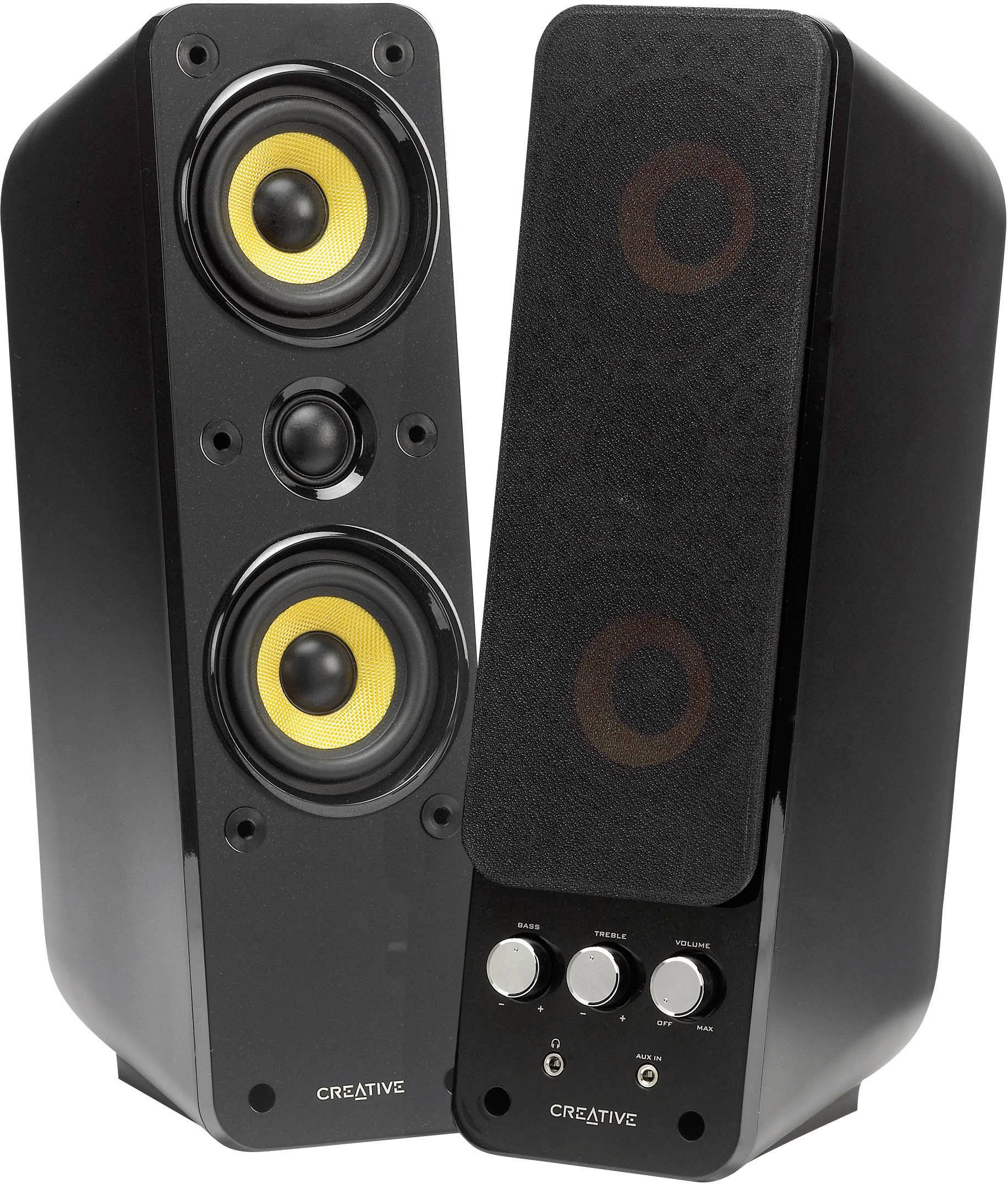 Twee zwarte luidsprekers met gele membranen en bedieningsknoppen op één van de speakers. Ze zijn van het merk Creative en staan naast elkaar.