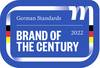 Niebieskie logo z napisem 'Niemieckie Standardy - Marka Stulecia 2022'. Zawiera motywy niemieckiej flagi.