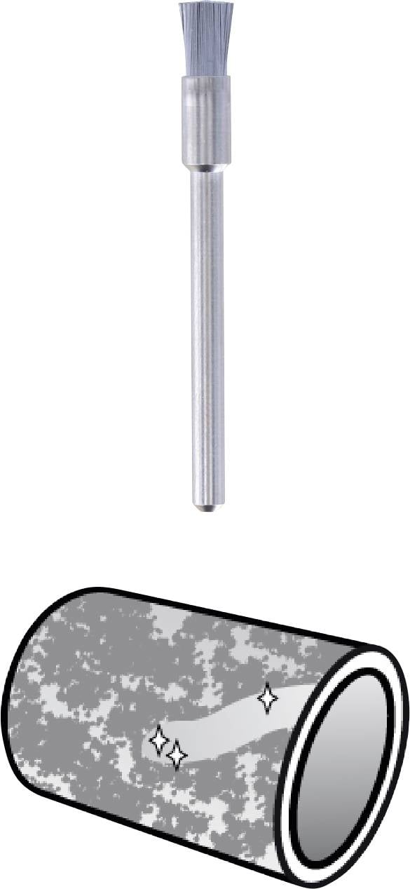 'Ilustracja przedstawia cylindryczne narzędzie z włosiem nad metalową powierzchnią. Powierzchnia błyszcząca i czysta.'