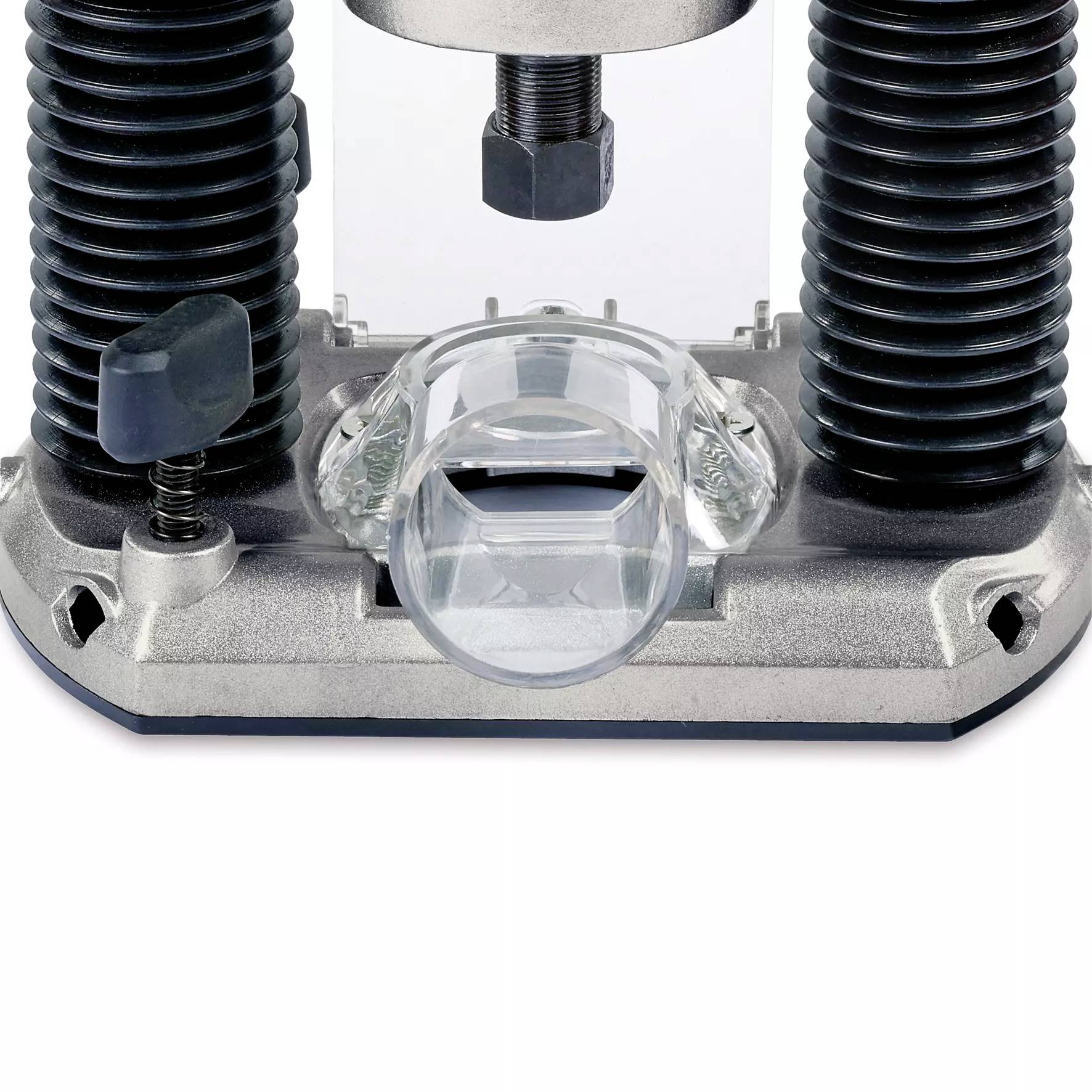 Zbliżenie elektrycznej frezarki górnowrzecionowej z przezroczystą osłoną, otoczoną śrubami i sprężynami, gotową do obróbki drewna.