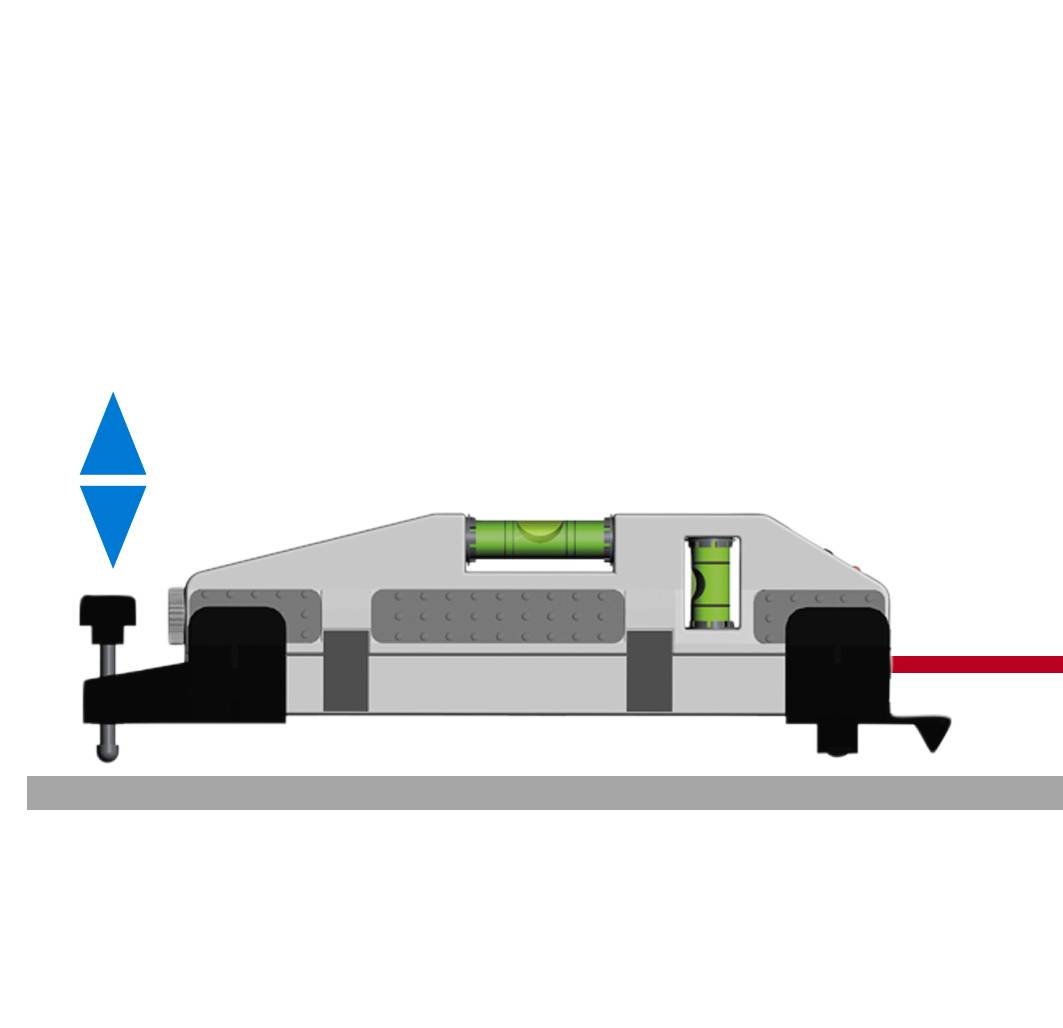 Srebrne, prostokątne urządzenie stoi na płaskiej powierzchni. Narzędzie przypominające poziomnicę wskazuje, że wszystko jest idealnie wypoziomowane.