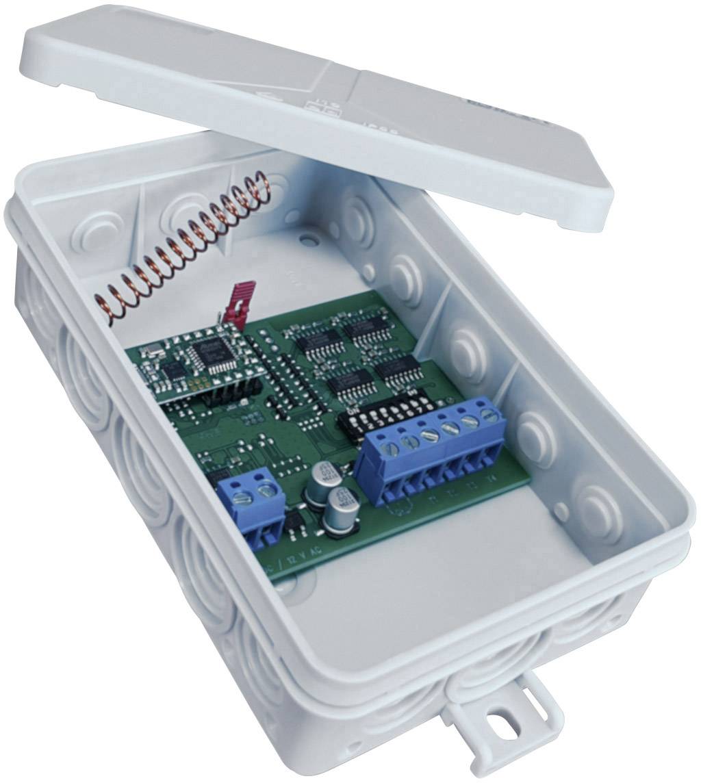 Obudowa elektroniczna z otwartą pokrywą przedstawia zieloną płytkę drukowaną z elementami i niebieskimi zaciskami przyłączeniowymi.