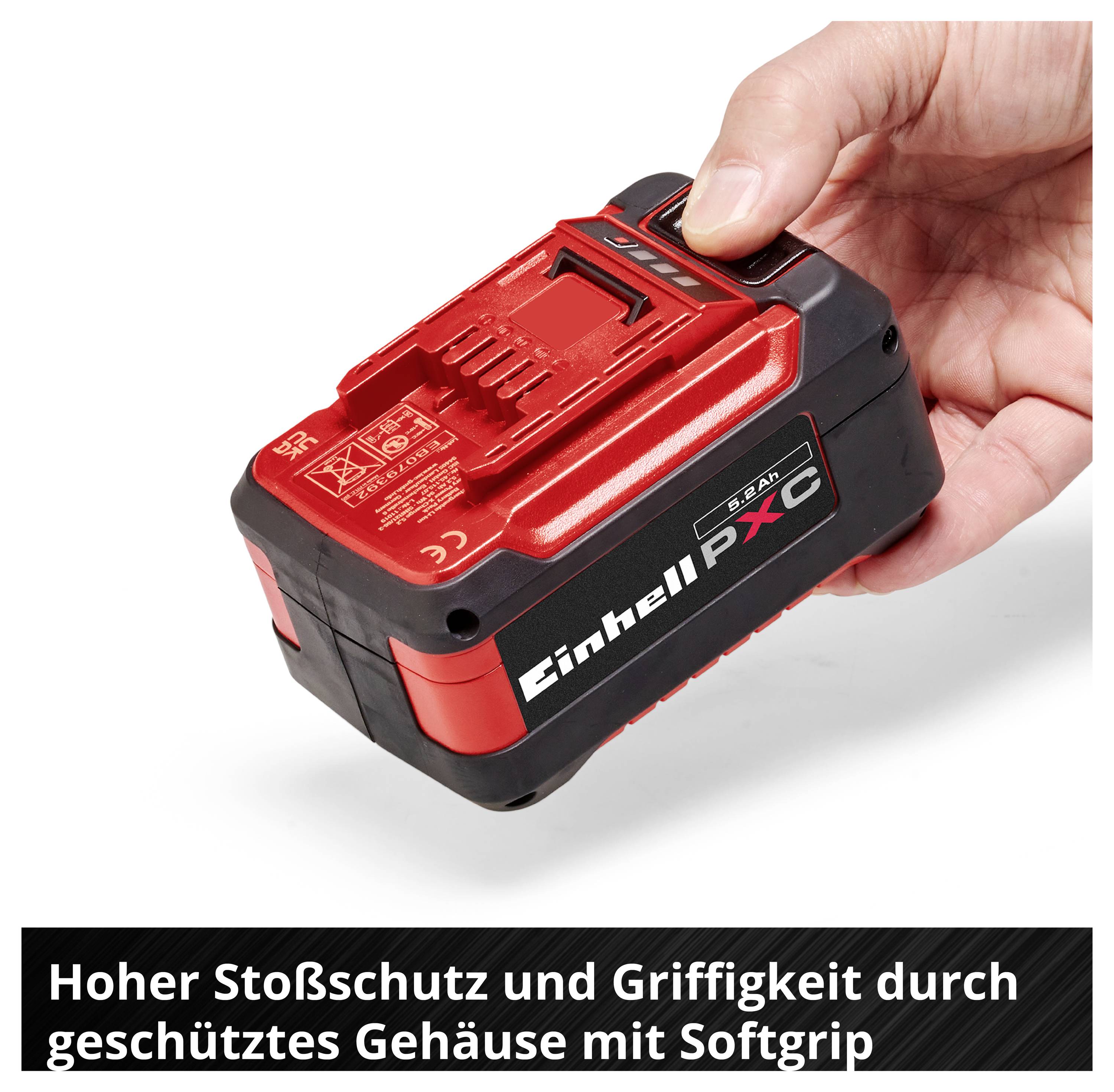 Ręka trzyma czerwoną i czarną baterię Einhell Power X-Change; u dołu napisane: 'Wysoka odporność na wstrząsy i dobry uchwyt dzięki chronionemu obudowaniu z miękkim uchwyt'.