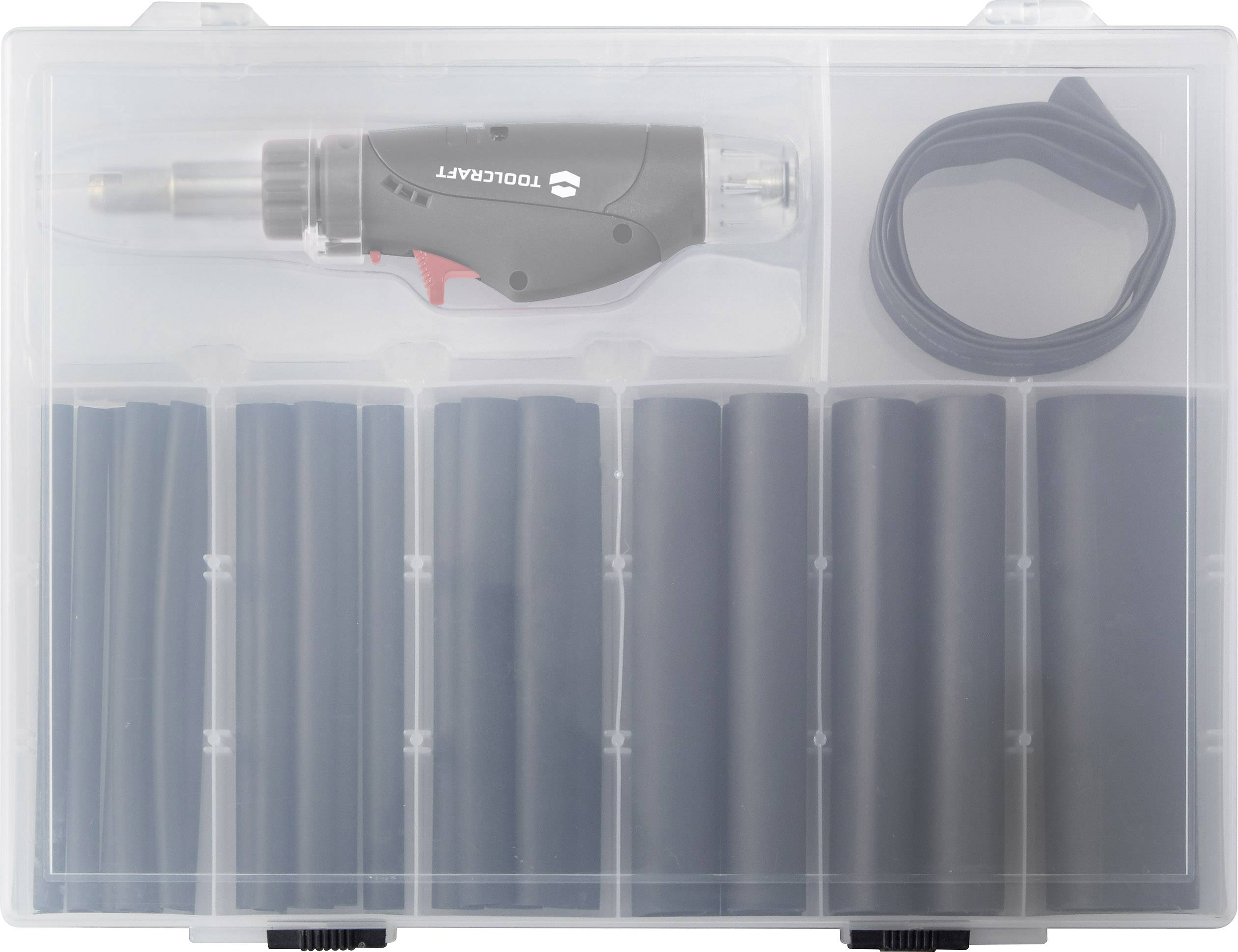 Zestaw lutowniczy w przezroczystym pudełku z tworzywa sztucznego, zawierający lutownicę, kilka rurek termokurczliwych oraz zwinięty kabel.