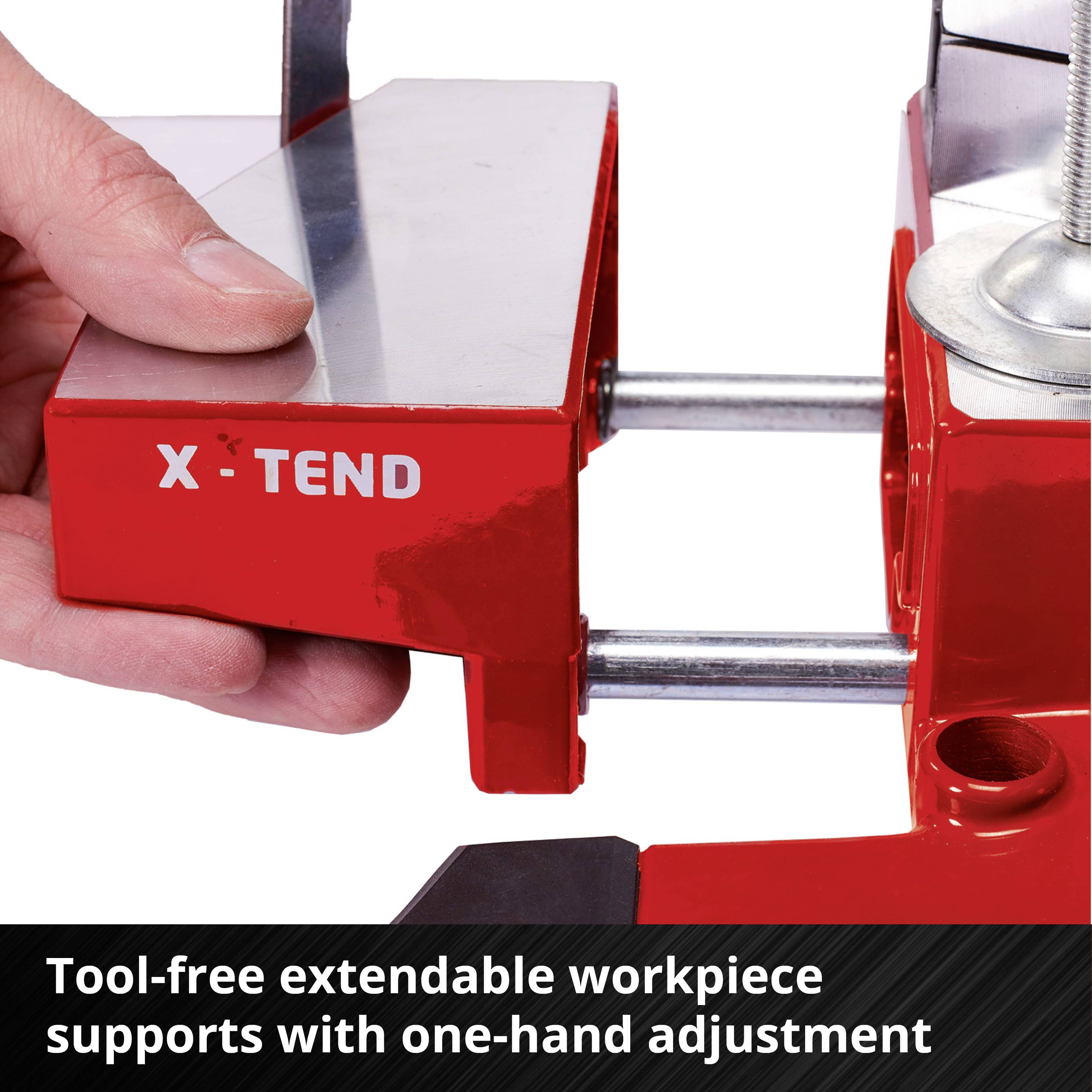 'Czerwona, beznarzędziowo wysuwana podstawa obrabianego elementu marki X-Tend w środowisku warsztatu.'