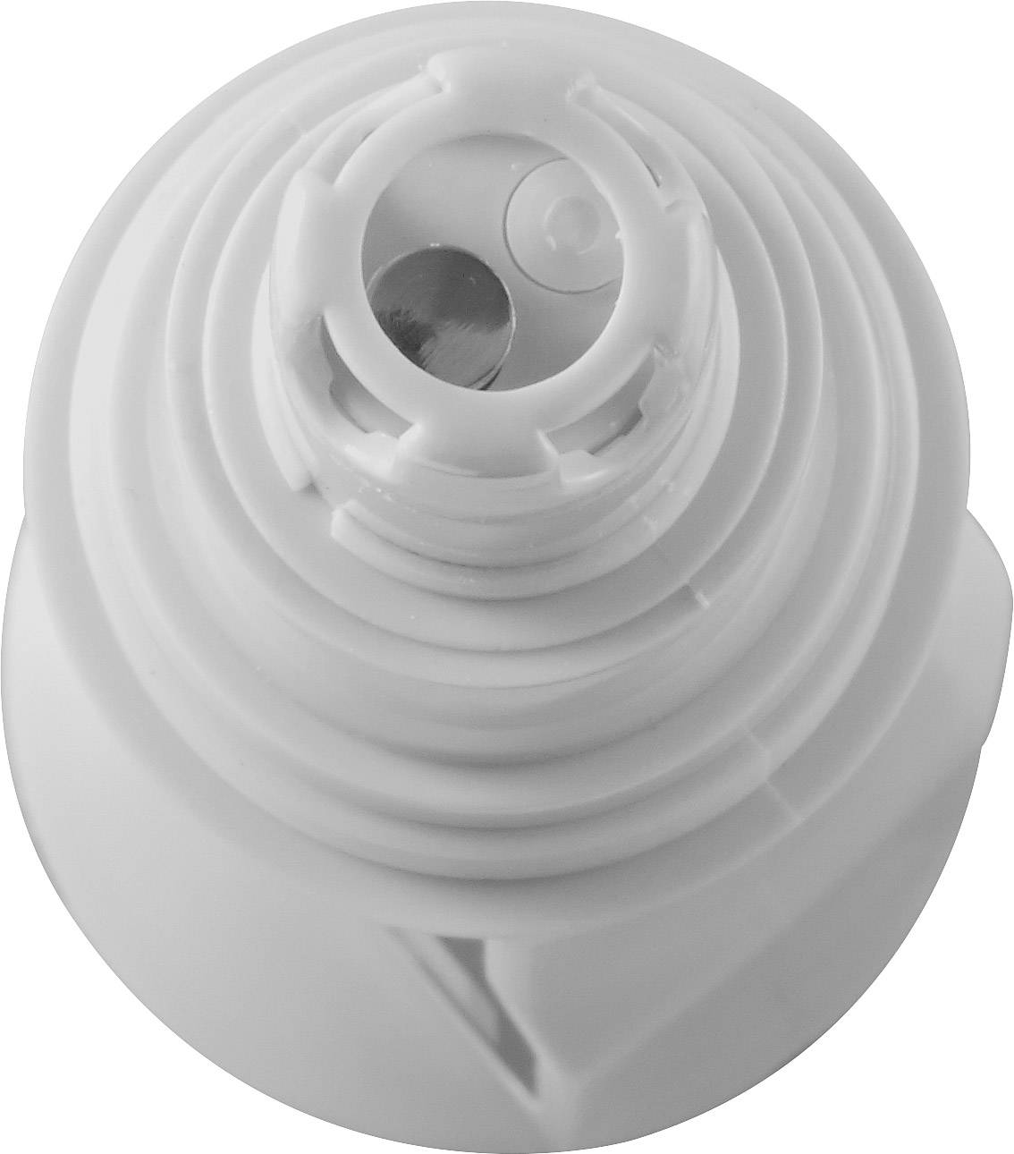 Biały, okrągły plastikowy korek widziany z góry, z kilkoma rowkami i małym metalowym elementem widocznym centralnie.