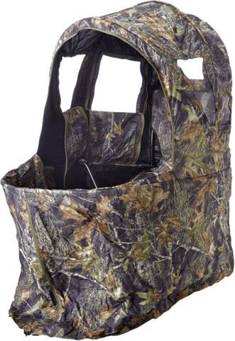 Namiot maskujący z wzorem liści i gałęzi, otwarty z przodu i góry, prawdopodobnie przeznaczony do polowania lub obserwacji dzikich zwierząt.