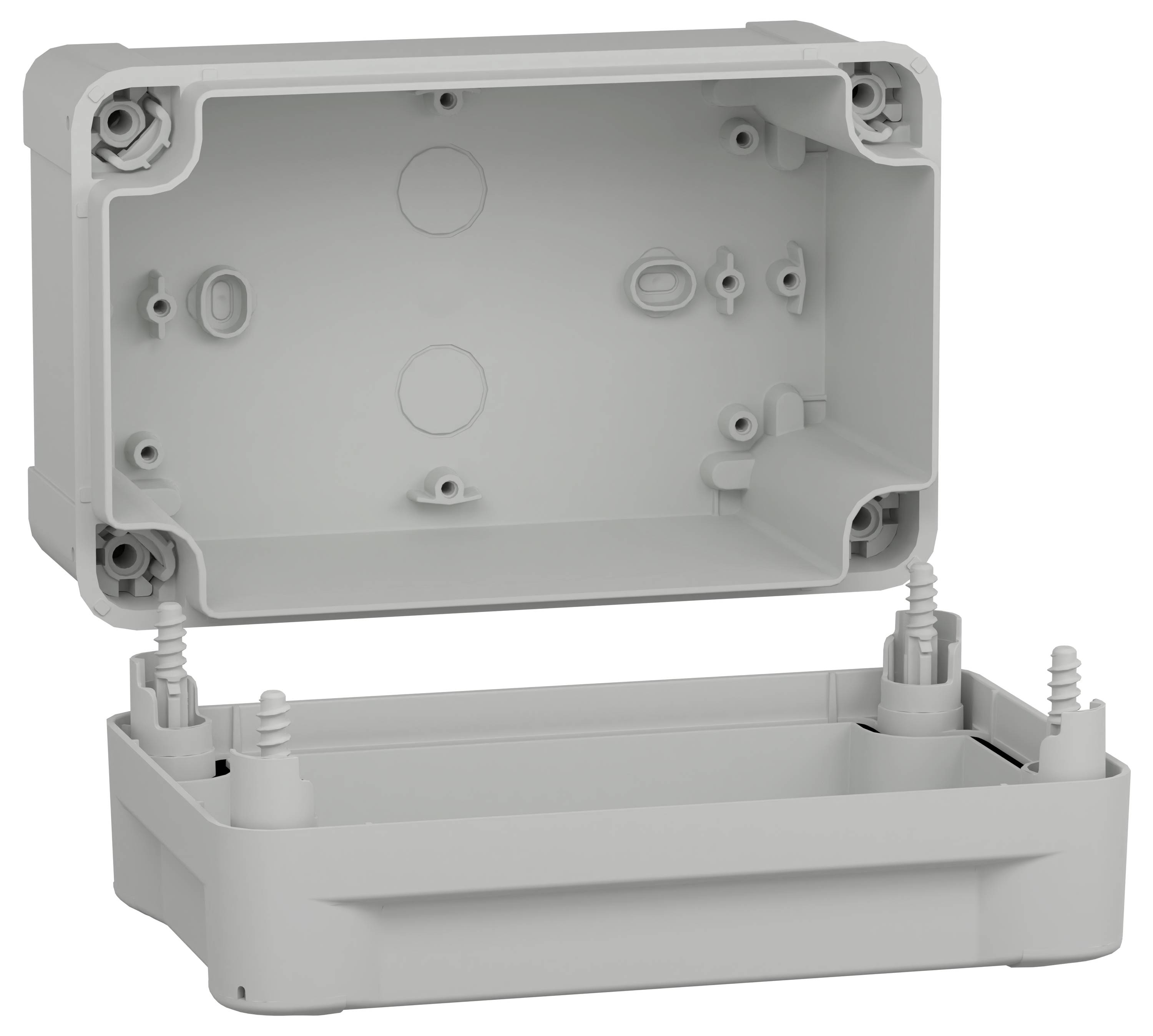 Otwarta, prostokątna, szara obudowa elektroniczna z widocznymi otworami montażowymi, przeznaczona do bezpiecznego przechowywania elementów elektrycznych.
