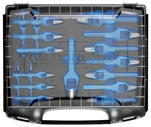 Zestaw niebieskich i srebrnych puncówek o różnych rozmiarach, starannie ułożonych w czarnym etui, przeznaczonych do precyzyjnego cięcia i kształtowania.