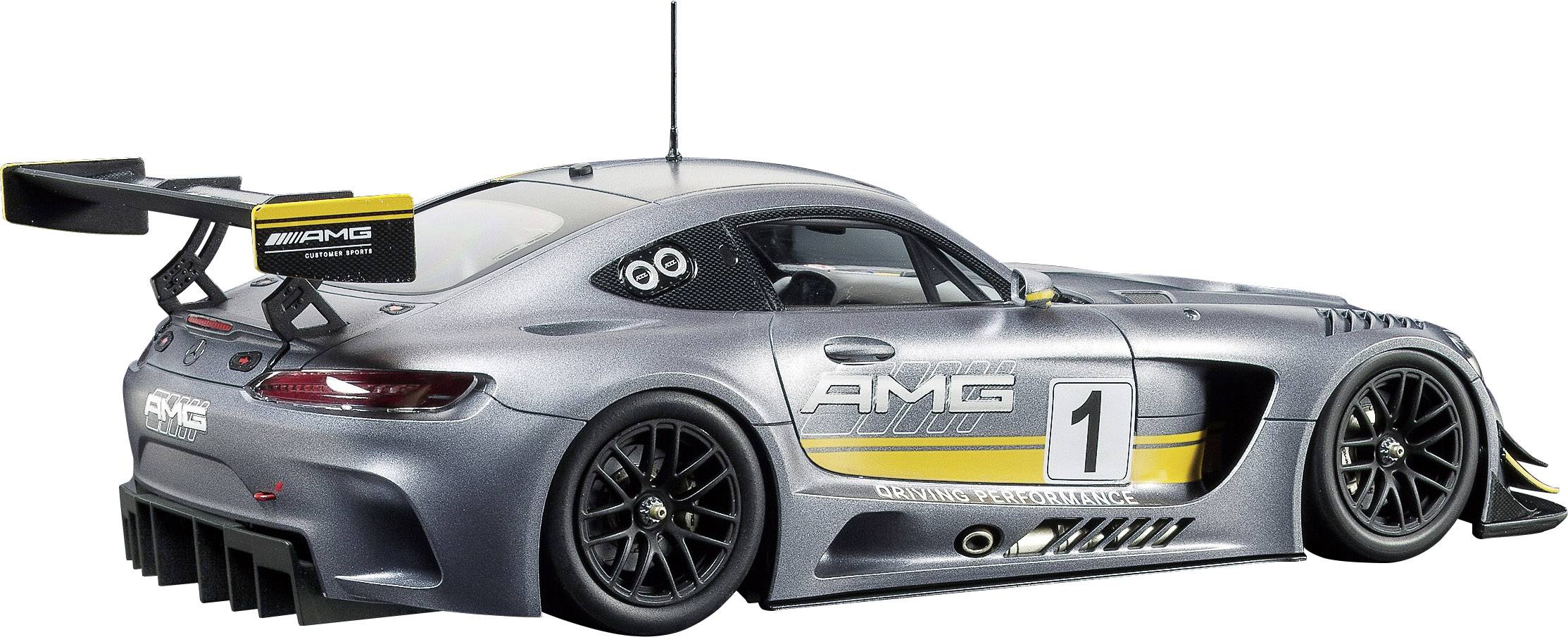Srebrny samochód wyścigowy z napisem 'AMG' i numerem '1' na drzwiach, z dużym tylnym skrzydłem, stojący na neutralnym tle.