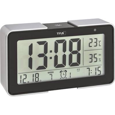 Elektroniczny zegar z dużym wyświetlaczem: godzina '13:08', temperatura '23°C', wilgotność '35% RH', data '12.18', budzik ustawiony na '7:15'.