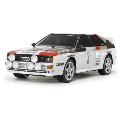 Samochód rajdowy w klasycznym stylu z logo sponsorów, takimi jak Audi, Castrol i Michelin, prezentujący numer startowy 3.