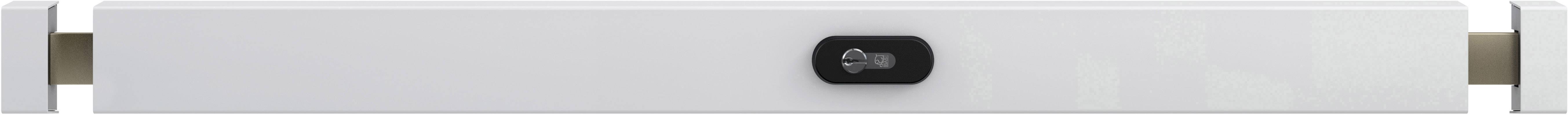 Białe, prostokątne urządzenie z czarnym, centralnie umieszczonym przyciskiem pośrodku, prawdopodobnie elektroniczny sprzęt gospodarstwa domowego.