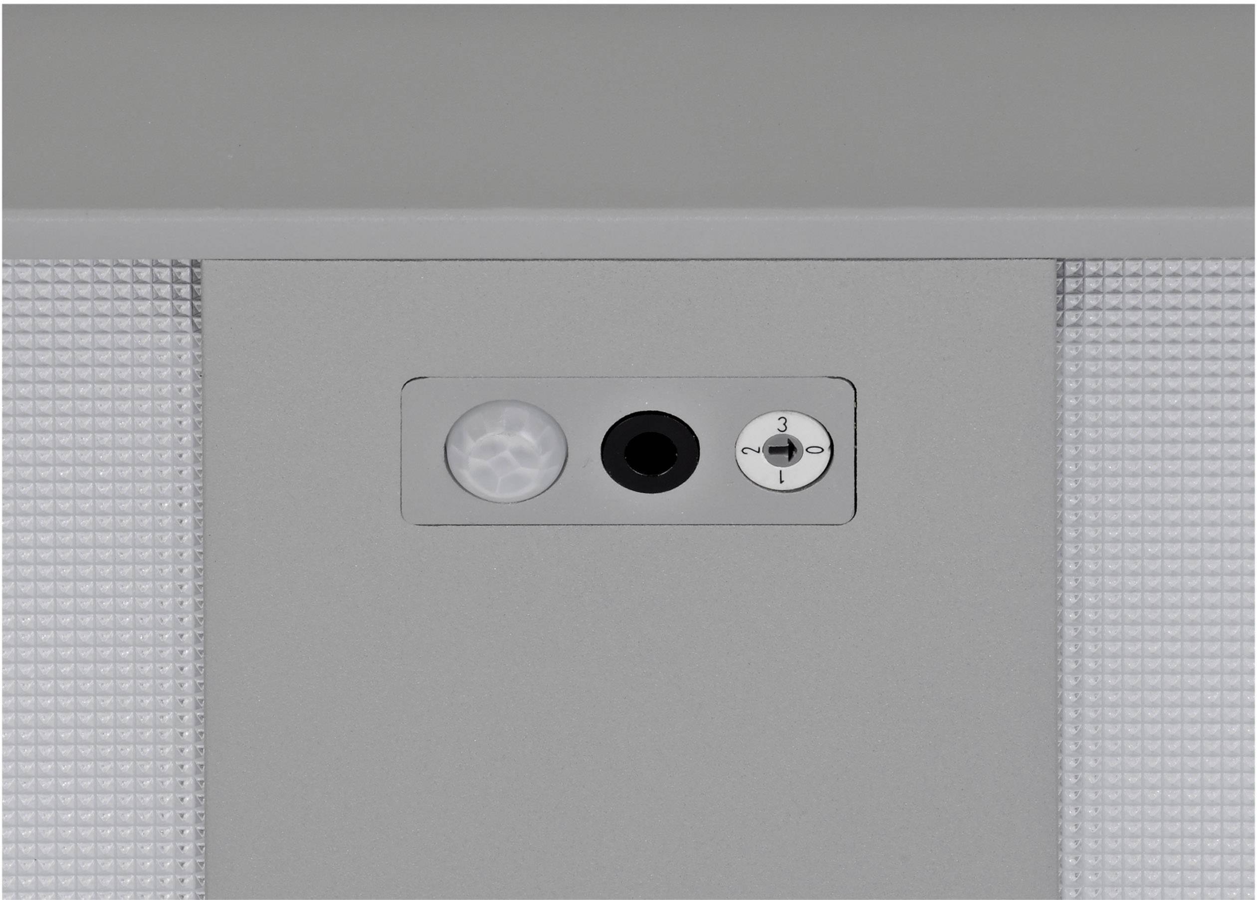 Szary czujnik ruchu, mikrofon i regulator głośności na jednym urządzeniu.