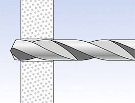Wiertło przewierca się przez materiał w kropki.