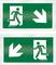 Zielony znak awaryjnego wyjścia z symbolem biegnącej postaci, białymi strzałkami skierowanymi w prawo i w dół, wskazujący kierunek ewakuacji.