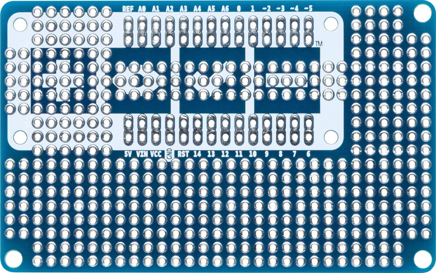 Niebieska płytka drukowana z licznymi gniazdami dla komponentów i połączeń. Posiada oznaczenia dla różnych pinów.