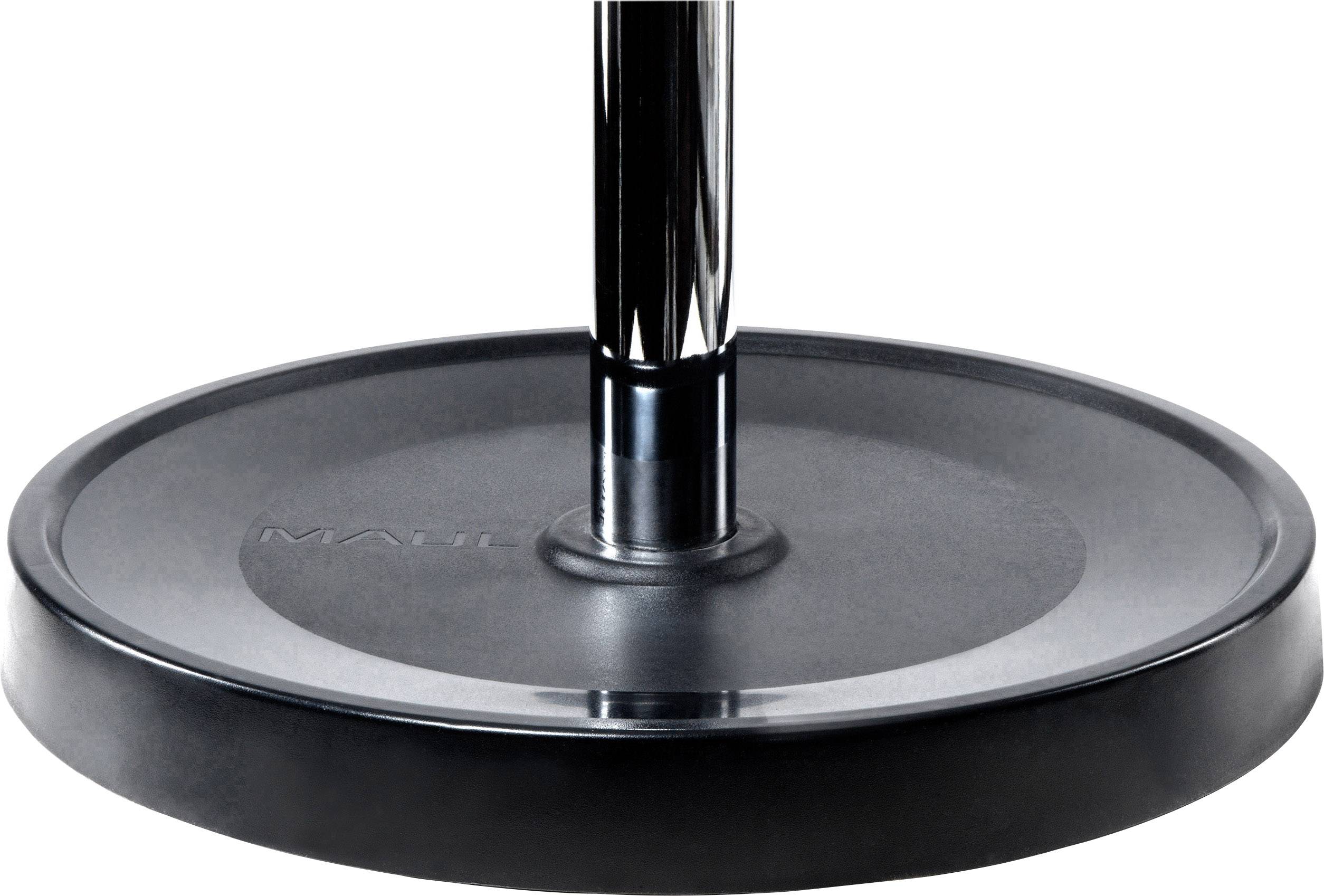 Okrągła czarna podstawa stojaka z pionową metalową rurą pośrodku.