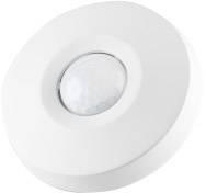 Okrągły, biały czujnik ruchu z centralnym sensorem. Idealny do wykrywania ruchu w pomieszczeniach zamkniętych.