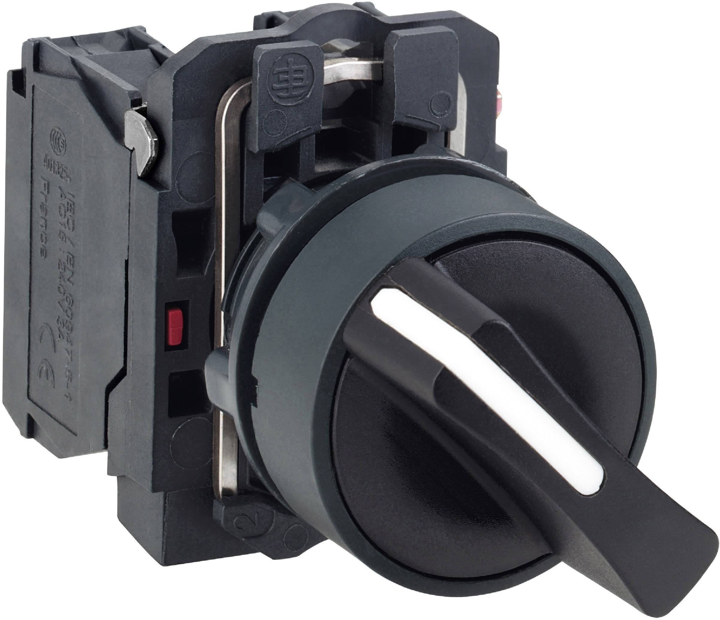 Czarny przełącznik obrotowy z białą rączką na szarym podłożu, ustawiony pod kątem 45 stopni w prawo. Komponent elektroniczny do systemów sterujących.