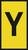 Żółta tablica z dużą, czarną literą 'Y' pośrodku.