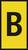 Żółta tabliczka z czarną literą 'B' pośrodku.
