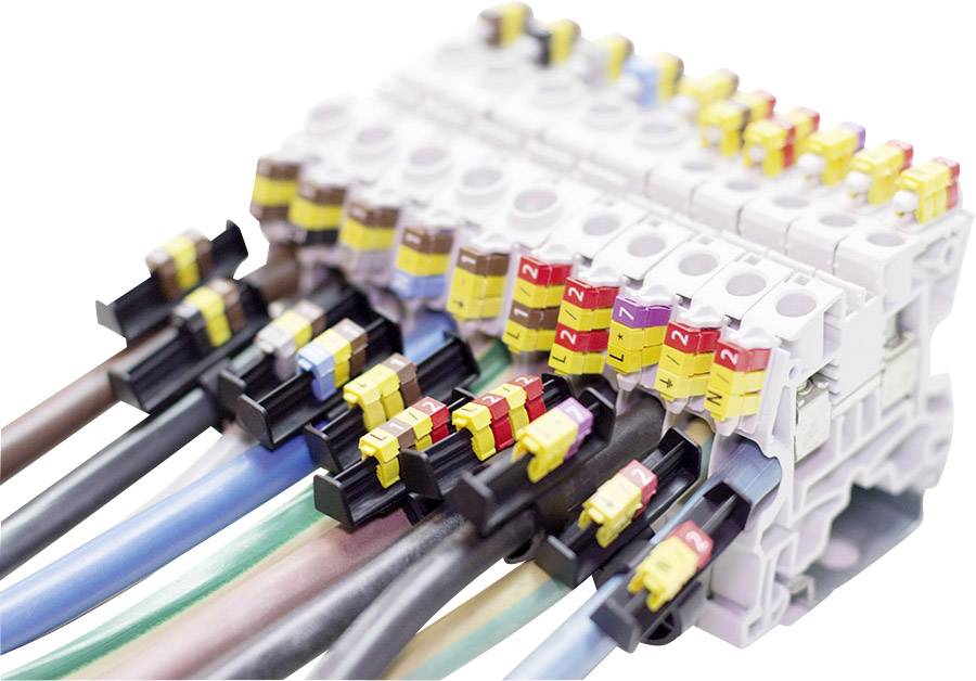 Elektryczne zaciski przyłączeniowe z przewodami w różnych kolorach i oznakowaniem, używane do połączeń w obwodach elektronicznych.