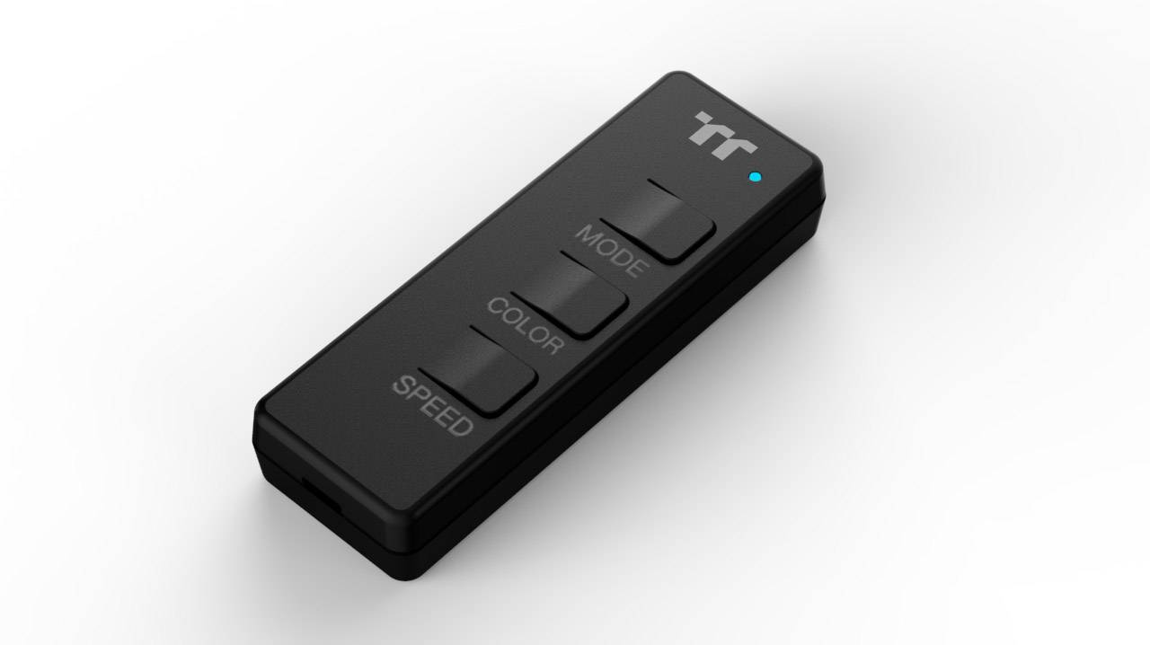 Czarna pilot zdalnego sterowania z trzema przyciskami: 'Tryb', 'Kolor' i 'Prędkość'. Na górze małe niebieskie światło oraz logo marki.