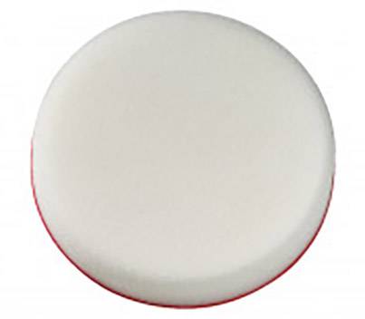 Biały, okrągły gąbka z czerwonym spodem, prawdopodobnie do celów czyszczących.