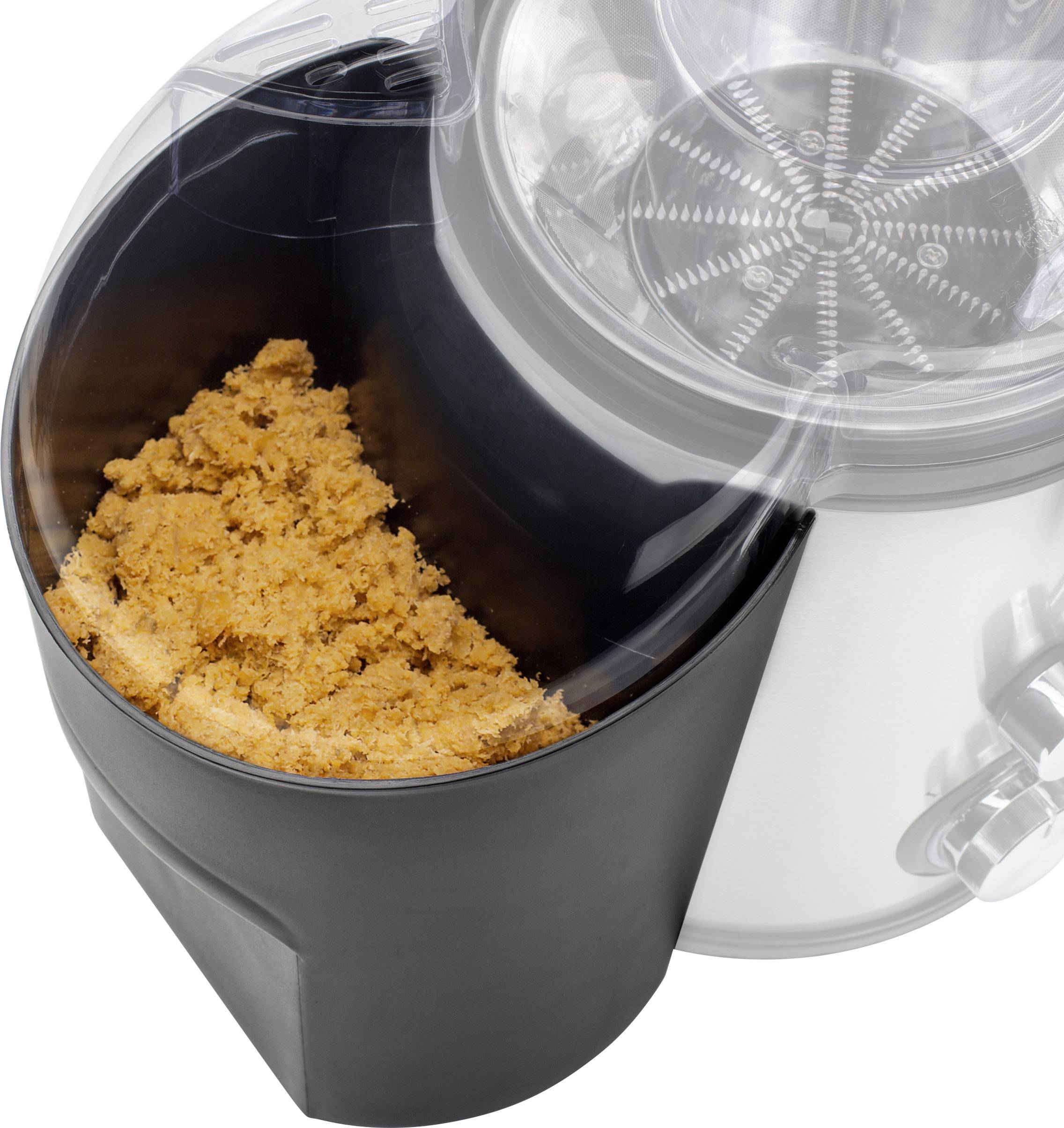 Młynek do kawy z świeżo zmielonym proszkiem kawowym w pojemniku, widoczny metalowy mechanizm mielący, urządzenie wykonane ze stali nierdzewnej i tworzywa sztucznego.