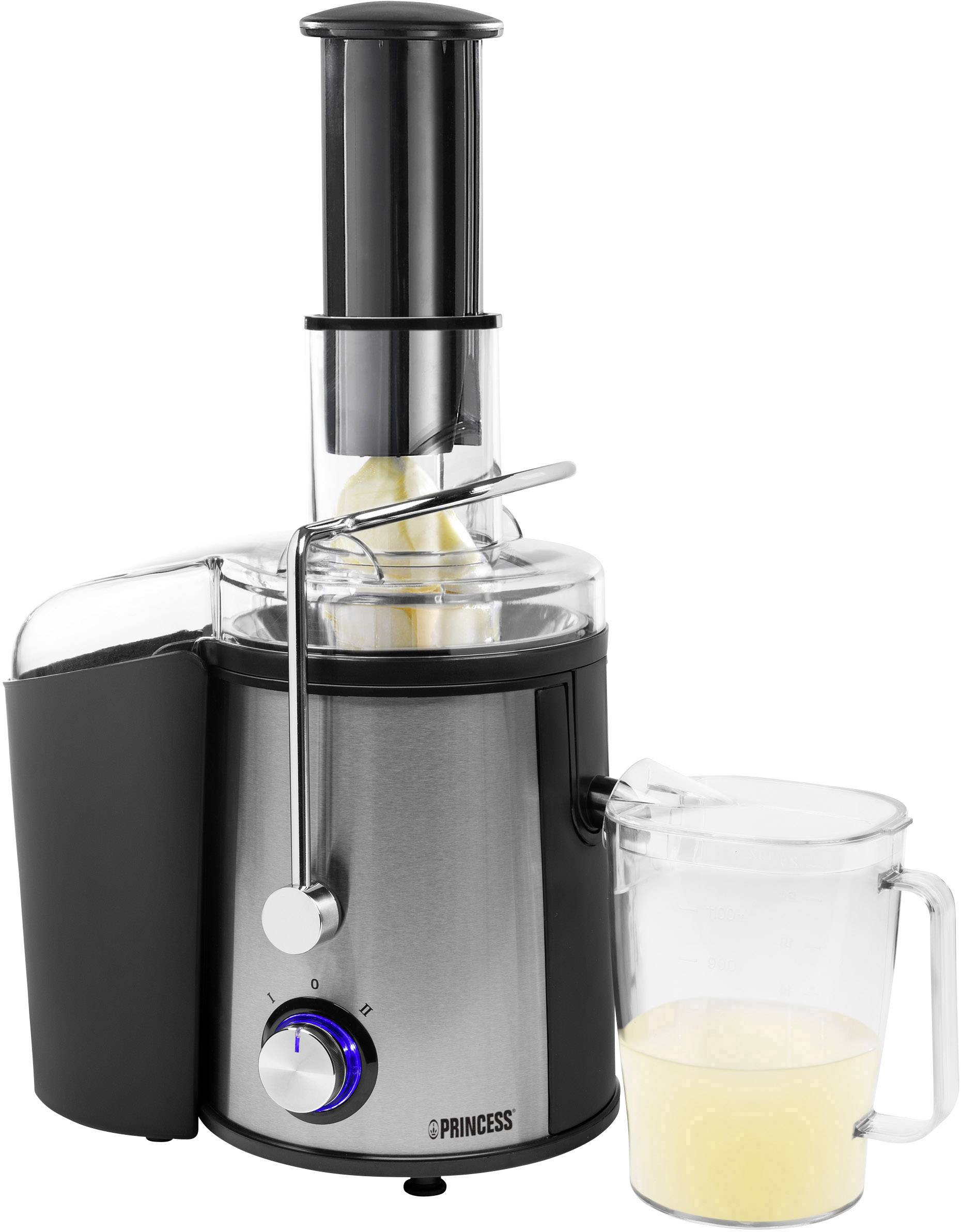 Sokowirówka ze stali nierdzewnej na blacie kuchennym z dzbankiem do zbierania świeżego soku.