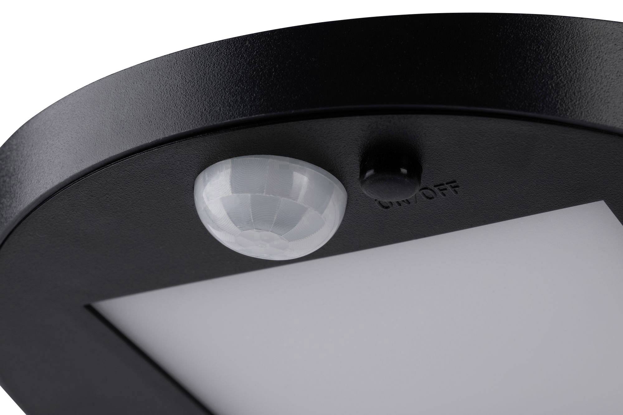 Zbliżenie czujnika ruchu w czarnej obudowie z przełącznikiem 'WŁ./WYŁ.'.